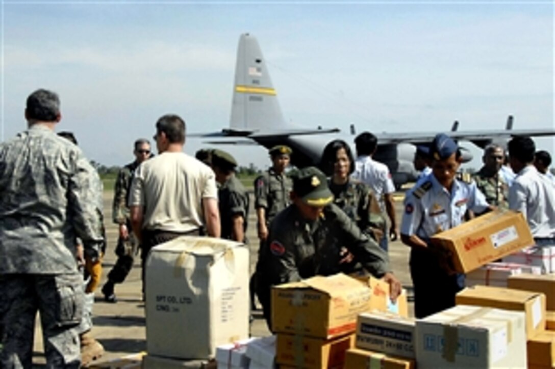 American troops and Royal Cambodian armed forces move supplies for Operation Pacific Angel, May 24, 2008, at Chhnang Province, Cambodia. Participating services include the active duty, National Guard and Reserve components of the U.S. Air Force, Army, Royal Thai air force, and Royal Cambodian armed forces. 