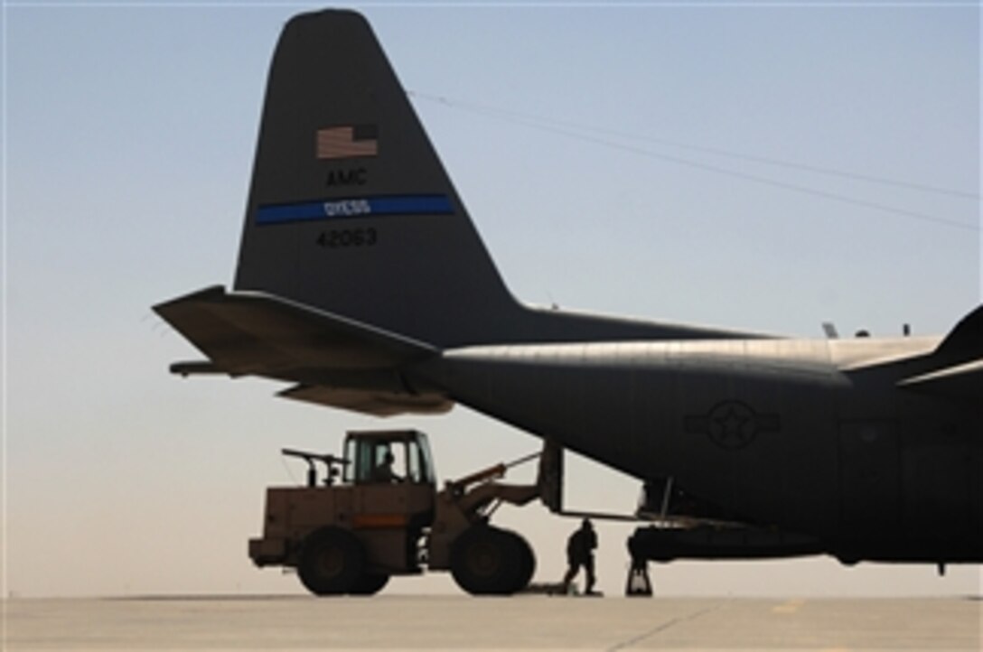 U.S. Air Force airmen with the 777th Expeditionary Airlift Squadron load cargo into a C-130 Hercules aircraft at Balad Air Base, Iraq, on May 10, 2008.  The squadron estimates it has prevented approximately 10,000 convoy vehicles and 27,000 service members from traveling along improvised explosive device laden roads since standing up in January of 2006.  