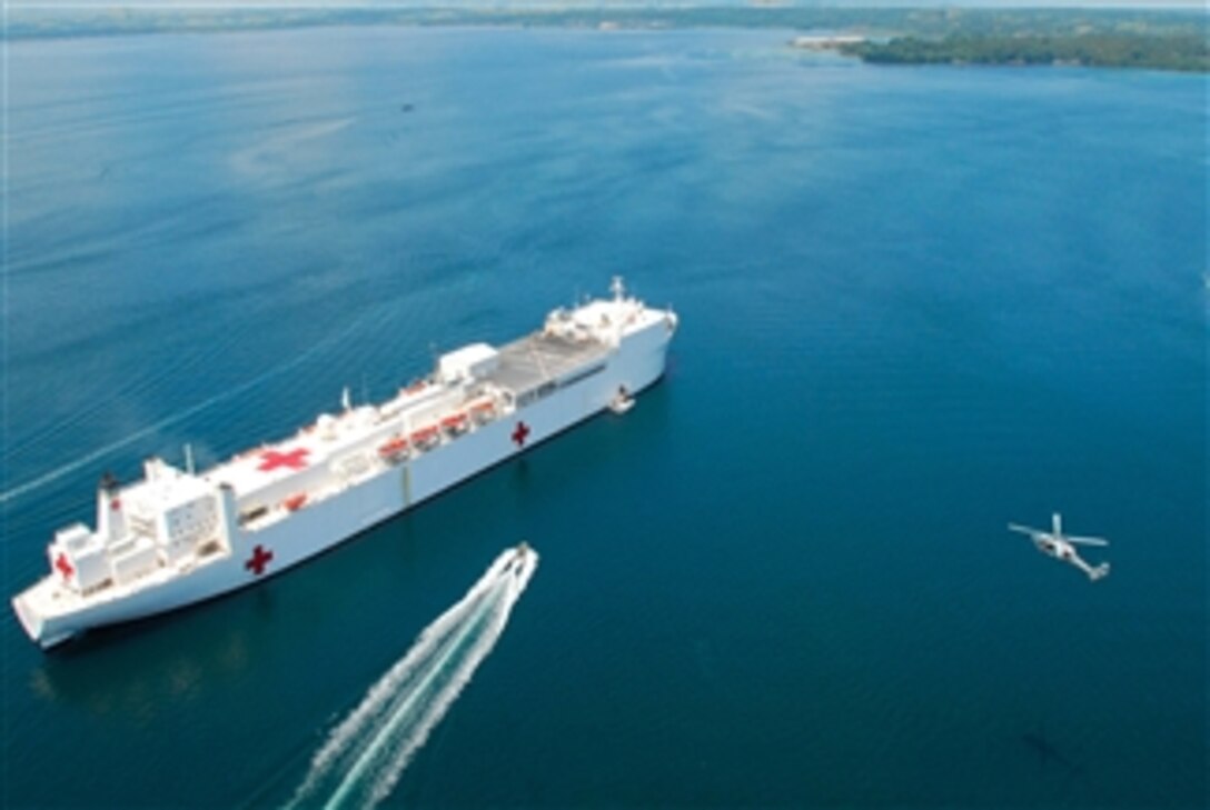 An MH-60S Seahawk helicopter from Helicopter Combat Squadron 21 returns to the hospital ship USNS Mercy (T AH 19) anchored off the coast of Cotabato, Philippines, on May 30, 2008.  The Mercy is deployed in support of Pacific Partnership 2008, a humanitarian and civil assistance mission, and is also scheduled to visit Vietnam, Timor-Leste, Papua New Guinea and Micronesia.  