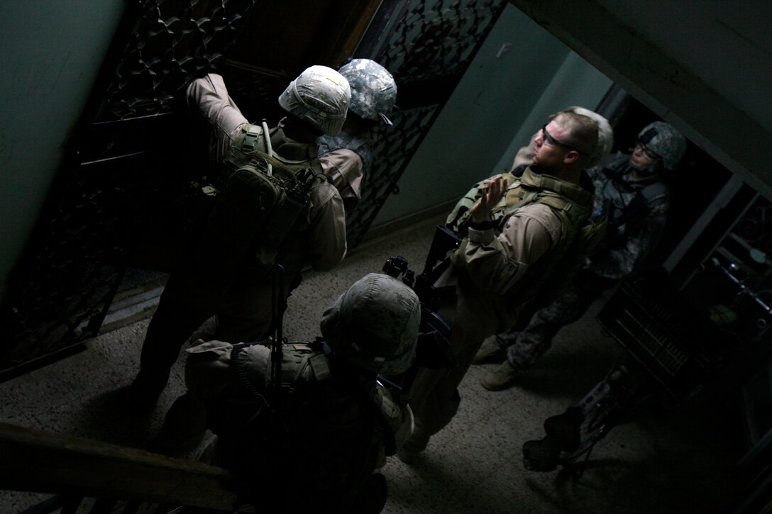 Marines and soldiers conduct house-to-house pulse patrols, which build rapport and figuratively keep a finger on the pulse of the people. The Marines are with Weapons Company, 3rd Battalion, 6th Marine Regiment, Regimental Combat Team 1.