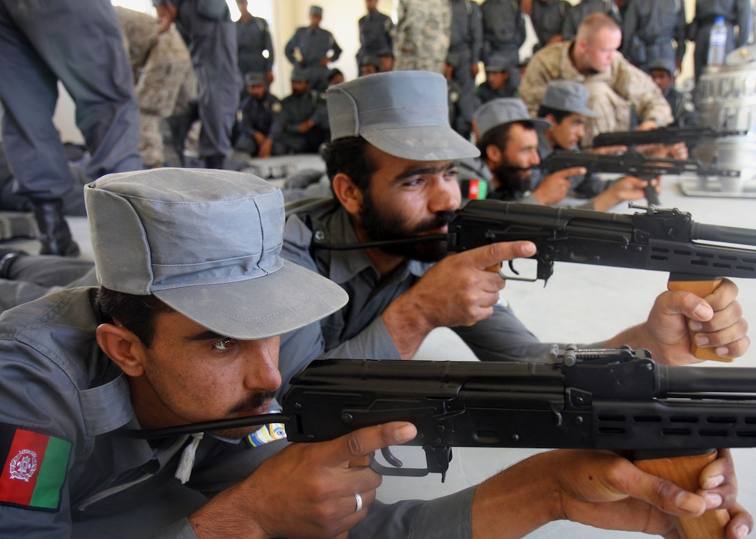 Afghan National Police Recruits, trained by Marines from 2nd Battalion, 7th Marine Regiment, practice firing stances with their AMD-65s aboard Lashkar Gah, June 4. 2nd Battalion 7th Marines, based out of Marine Air Ground Combat Center 29 Palms, is a reinforced light infantry battalion deployed to Afghanistan in support of Operation Enduring Freedom.