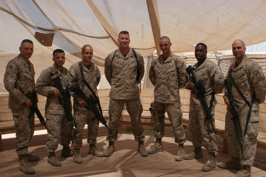 AT-TAQADDUM, Iraq (June 4, 2008) â?? (From left) Cpl. John M. Crawford, Cpl. Samuel Becerra, Cpl. Ronnie J. Vance, Sgt. Steven M. Holtsclaw, Sgt. Kevin R. Overton, Cpl. Jeremy D. Brown and Cpl. Kenton J. Hinkle, pose for a photo in Iraq. These corporals and sergeants were meritoriously promoted, some from a selection board and others for their actions while serving. These Marines are with 2nd Low Altitude Aircraft Defense Battalion, Marine Air Control Group 28, 2nd Marine Aircraft Wing. Their mission in Iraq is to provide security for Camp Taqaddum and Camp Habbaniyah. (Photo by Lance Cpl. Robert C. Medina)