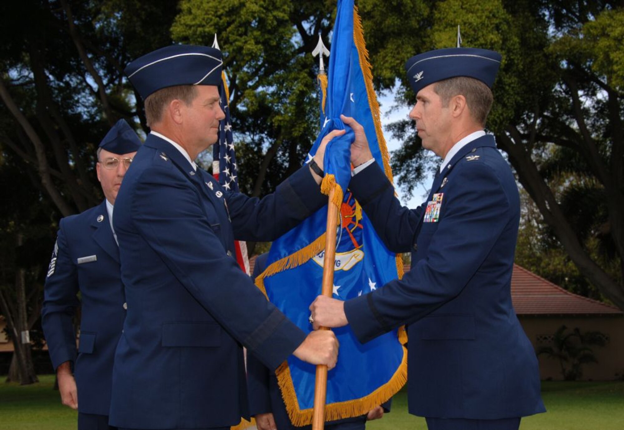 Col. Richard A. McClain, assumes command of the 515th Air Mobility Operations Wing during an activation ceremony at the Freedom Tower Mall, Hickam AFB, Hi, June 5, 2008.  Brig. Gen. Mark Stearns, commander, 15th Expeditionary Mobility Task Force, Travis AFB, Calif., was the presiding officer for the wing activation ceremony.  The 515th AMOW is the first wing AMC has established overseas since the command’s formation in 1992. Supporting AMC aircraft and crews transiting the Pacific, the wing becomes the headquarters for the existing 715th Air Mobility Operations Group at Hickam, and the new 515th AMOG at Yokota Air Base, Japan.. (U.S. Air Force Photo/Vanessa Perez)