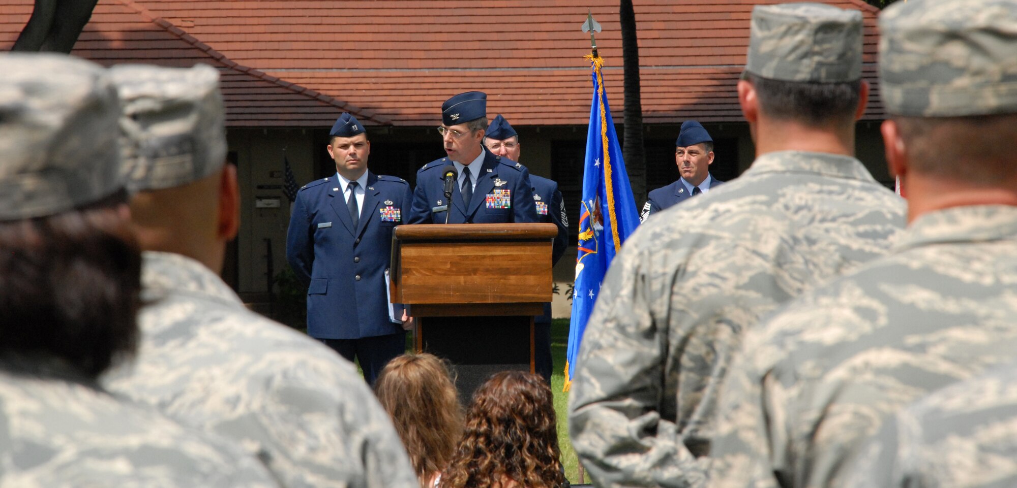 Col. Richard A. McClain talks to Airmen about the 515th Air Mobility Operations Wing, after he takes command during a wing activation ceremony, June 5 at the Freedom Tower Mall. (U.S. Air Force Photo/Staff Sgt. Erin Smith)