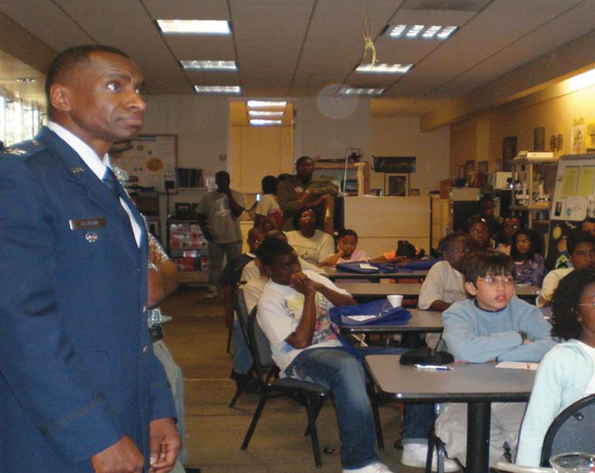 Col Kenneth Allison, chief, Concept Development Division, Space and Missile Systems Center,  stresses to young students the importance of involvement in science and technology both in general and for the future of the Armed Services.   