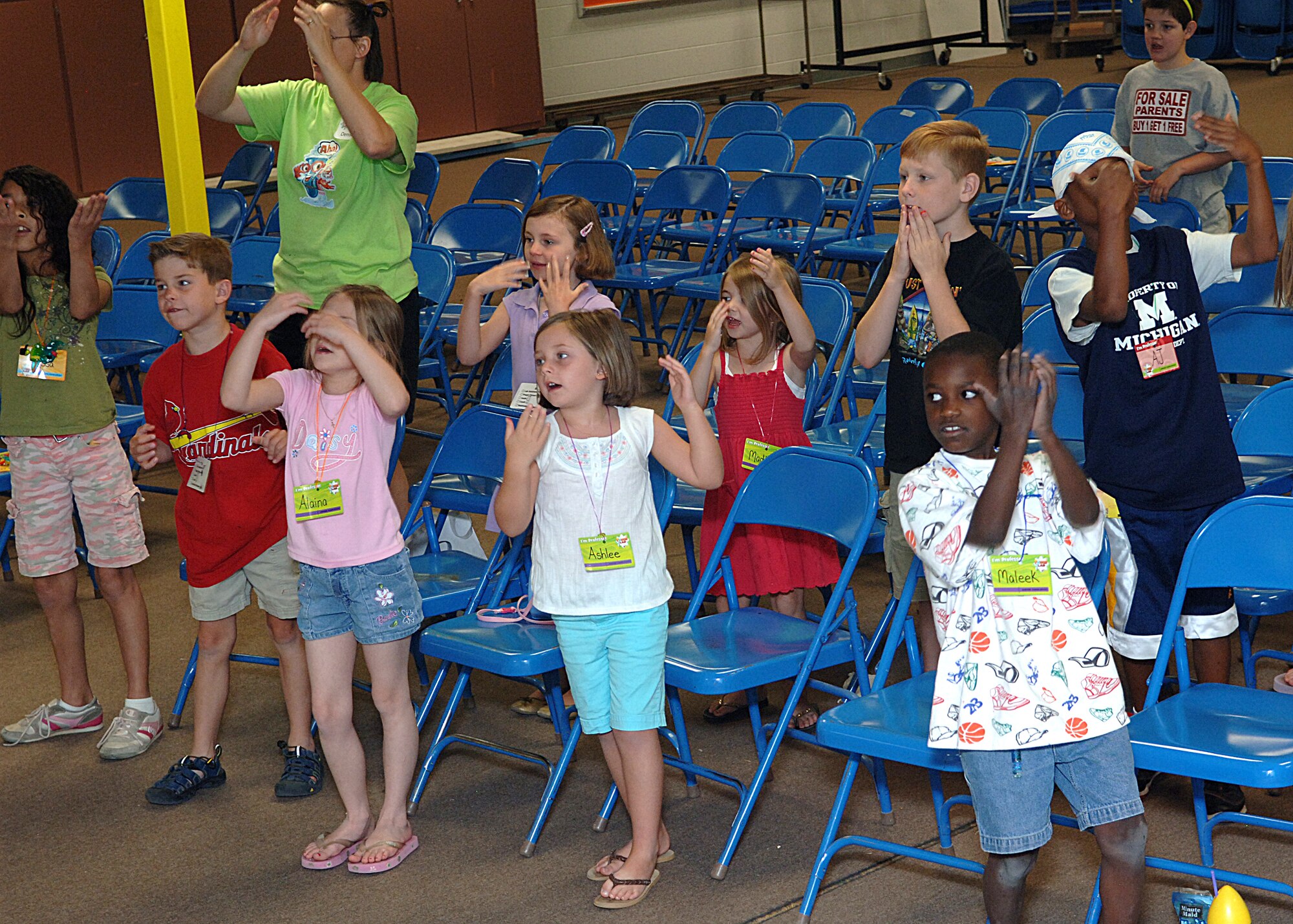 The children of the vocational bible school perform a hand dance, June 5.  (U.S. Air Force photo/Airman 1st Class John Strong) 
  
