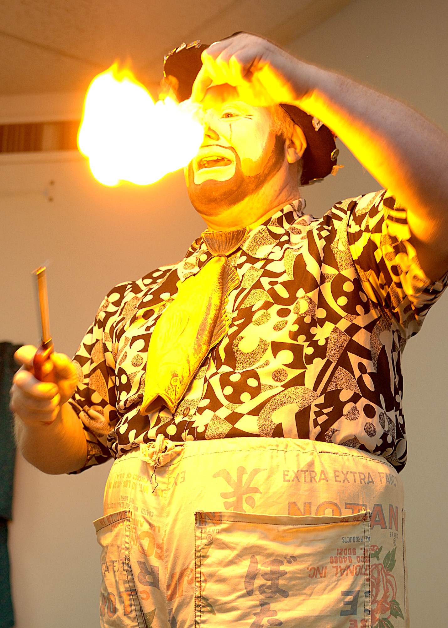 Fester the clown exhibits how once our sins have been forgiven they are gone forever by burning paper during a vacation bible school class, June 5.  (U.S. Air Force photo/Airman 1st Class John Strong) 

  