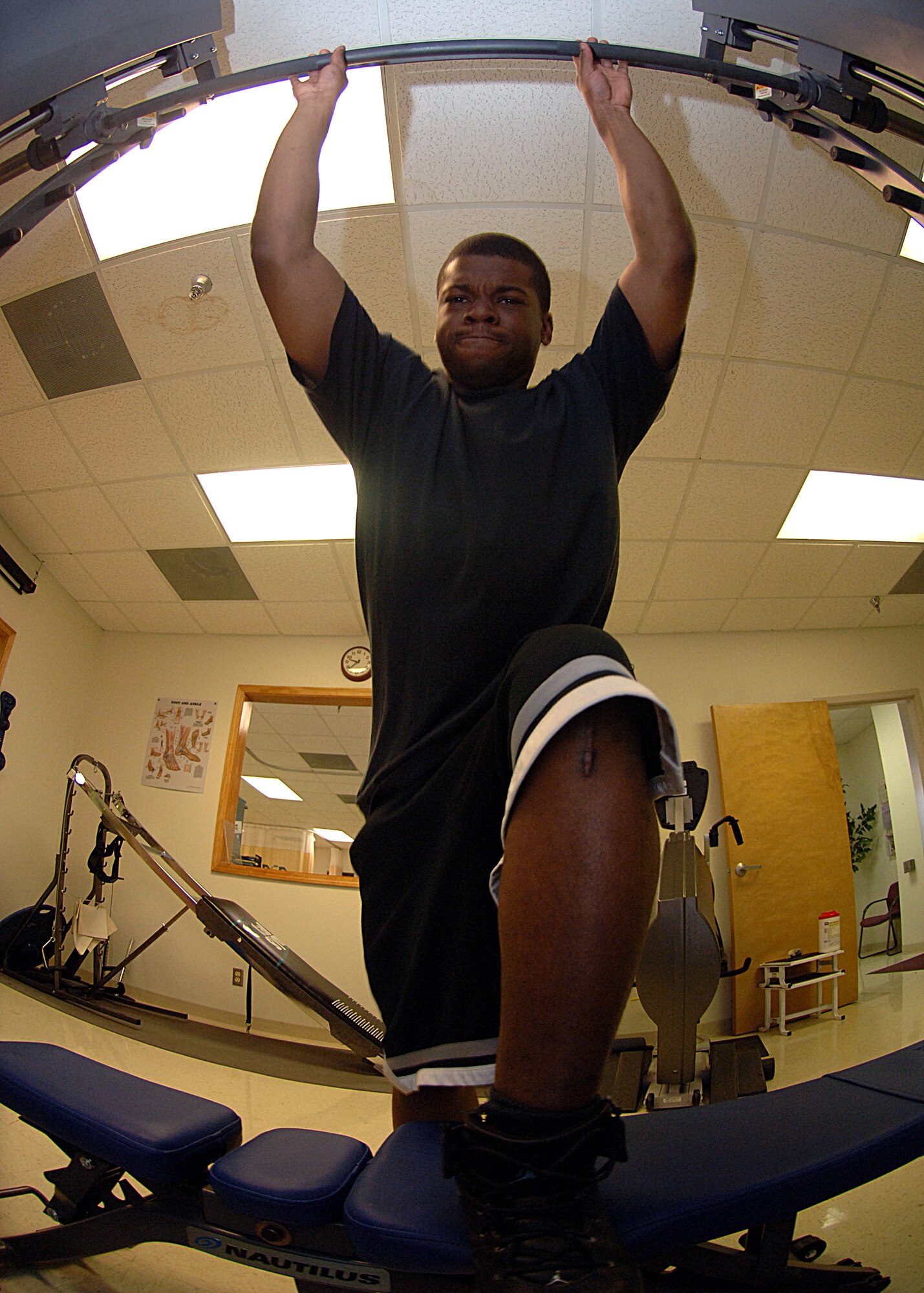 Senior Airman Michael French of the 49th Force Support Squadron performs a step up exercise at the physical therapy clinic on Holloman Air Force Base, N.M., June 5.  Airman French's physical therapy has helped his knee almost return back to perfect health.  (U.S. Air Force photo/Airman 1st Class John Strong) 
  