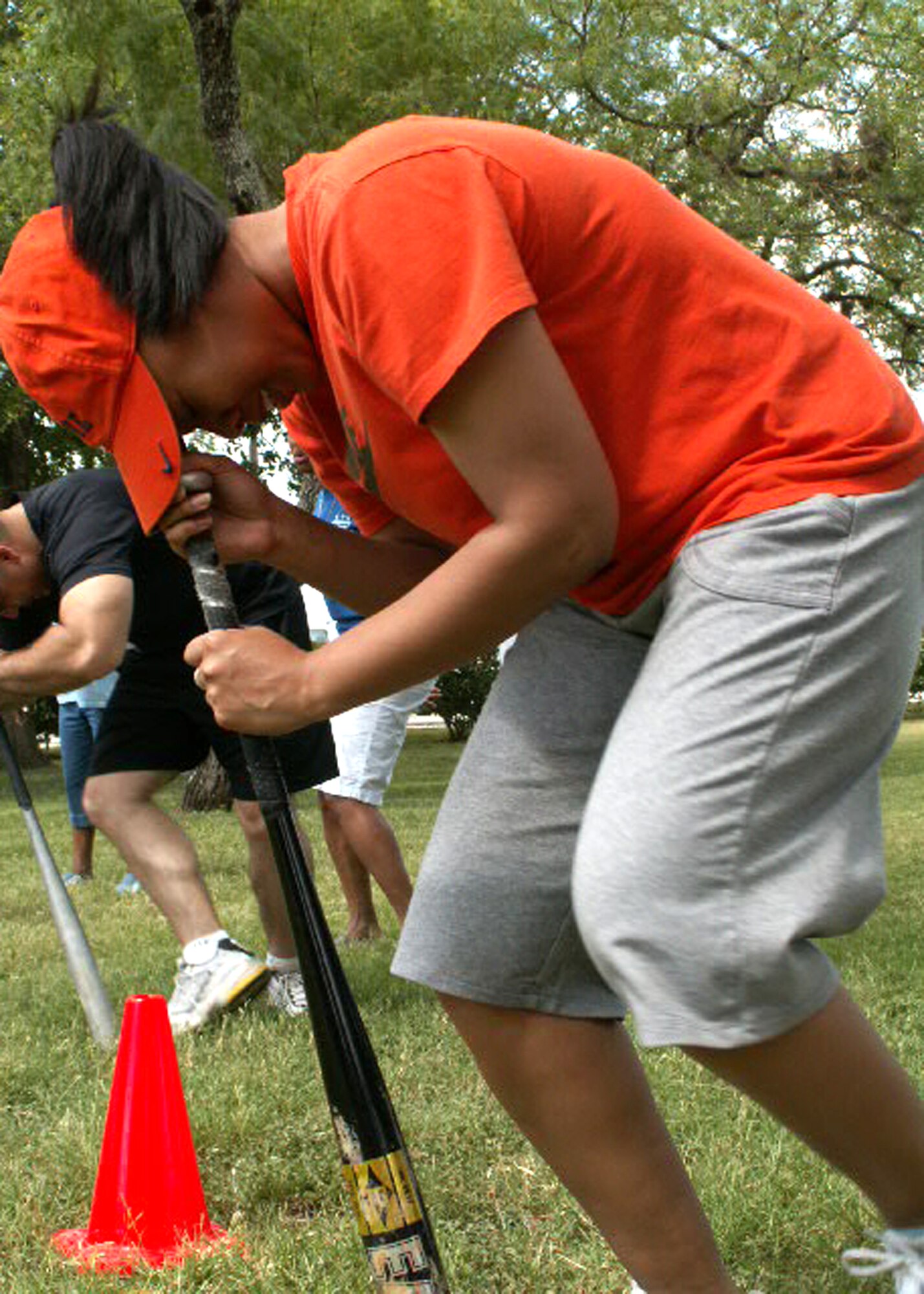 Tech. Sgt. Andrea Hall goes a little batty during the Air Force Personnel Center's sports day here at Randolph Air Force Base, Texas, June 4. Sergeant Hall's team, from personnel services, earned third place in the dizzy bat relay. Dizzy bat was just one of the many wacky and traditional sporting events chosen to boost morale and esprit de corps within AFPC. (US Air Force photo/Master Sgt. Kat Bailey) 