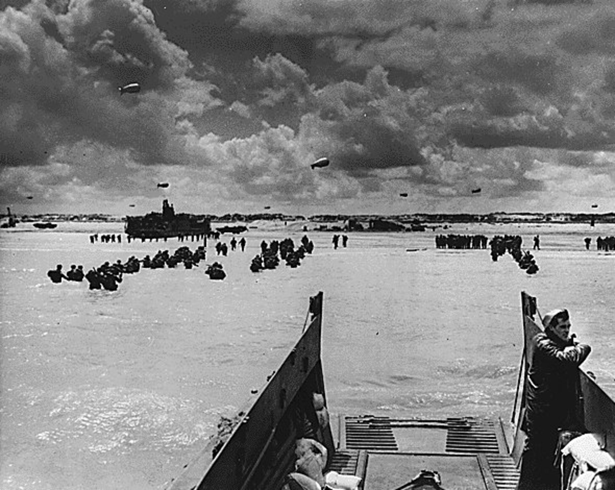 U.S. NATIONAL ARCHIVES -- American troops invade Normandy, while troops fought their way across the beaches, naval gunfire provided support. (courtesy photo)