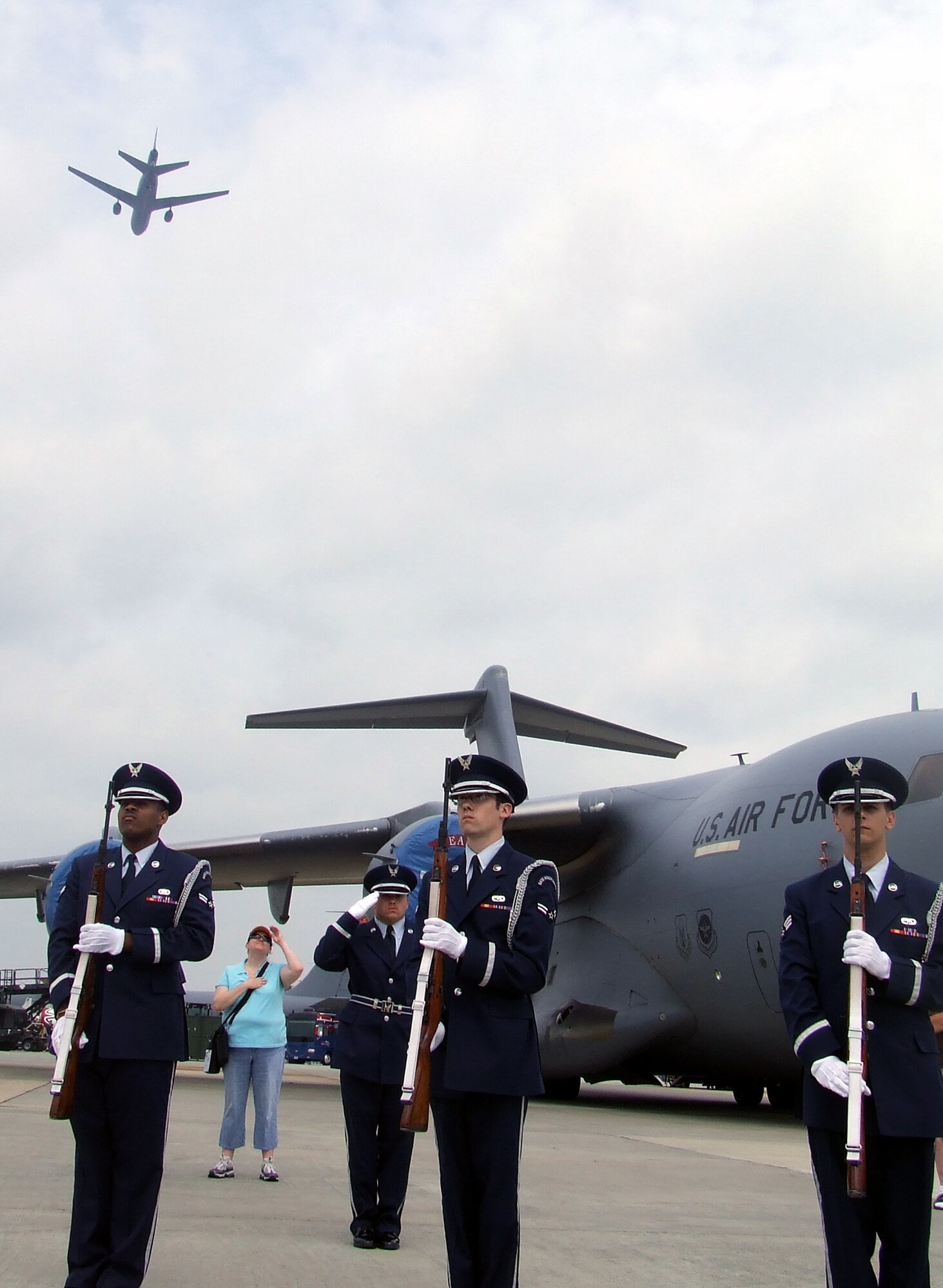 Airmen from the McGuire Air Force Base Honor Guard participate in a wreath-laying ceremony as a KC-10 Extender flies over during McGuire's Air Expo May 31, 2008.  Air Expo 2008 was the culminating event for Air Force Week in Philadelphia and drew more than 170,000 people to the base to see aircraft static and aerial displays and numerous other entertainment options.  (U.S. Air Force Photo/Tech. Sgt. Scott T. Sturkol)