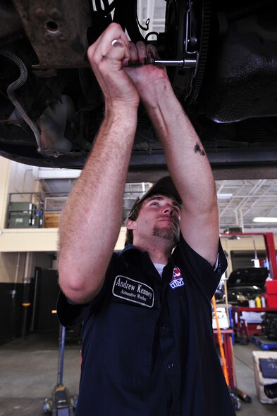 MOODY AIR FORCE BASE, Ga. -- Andrew Kenney, 23rd Force Support Squadron Hobby Shop automotive worker, tightens pressure plate bolts here June 5. The Hobby Shop offers a wide range of automotive services. (U.S. Air Force photo by Senior Airman Elizabeth Rissmiller) 