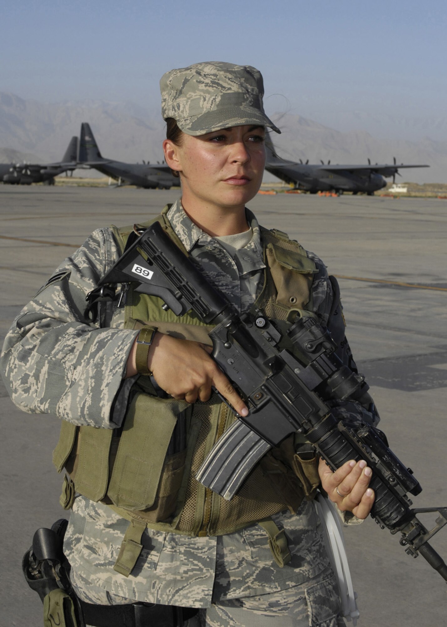 BAGRAM AIR FIELD, Afghanistan - Airman 1st Class Nicole Lopez, 455th Expeditionary Security Forces Squadron flightline security, monitors the flightline here June 4. Airman Lopez is deployed from 355th Security Forces Squadron, Davis-Monthan Air Force Base, Ariz. (U.S. Air Force photo by Master Sgt. Demetrius Lester)