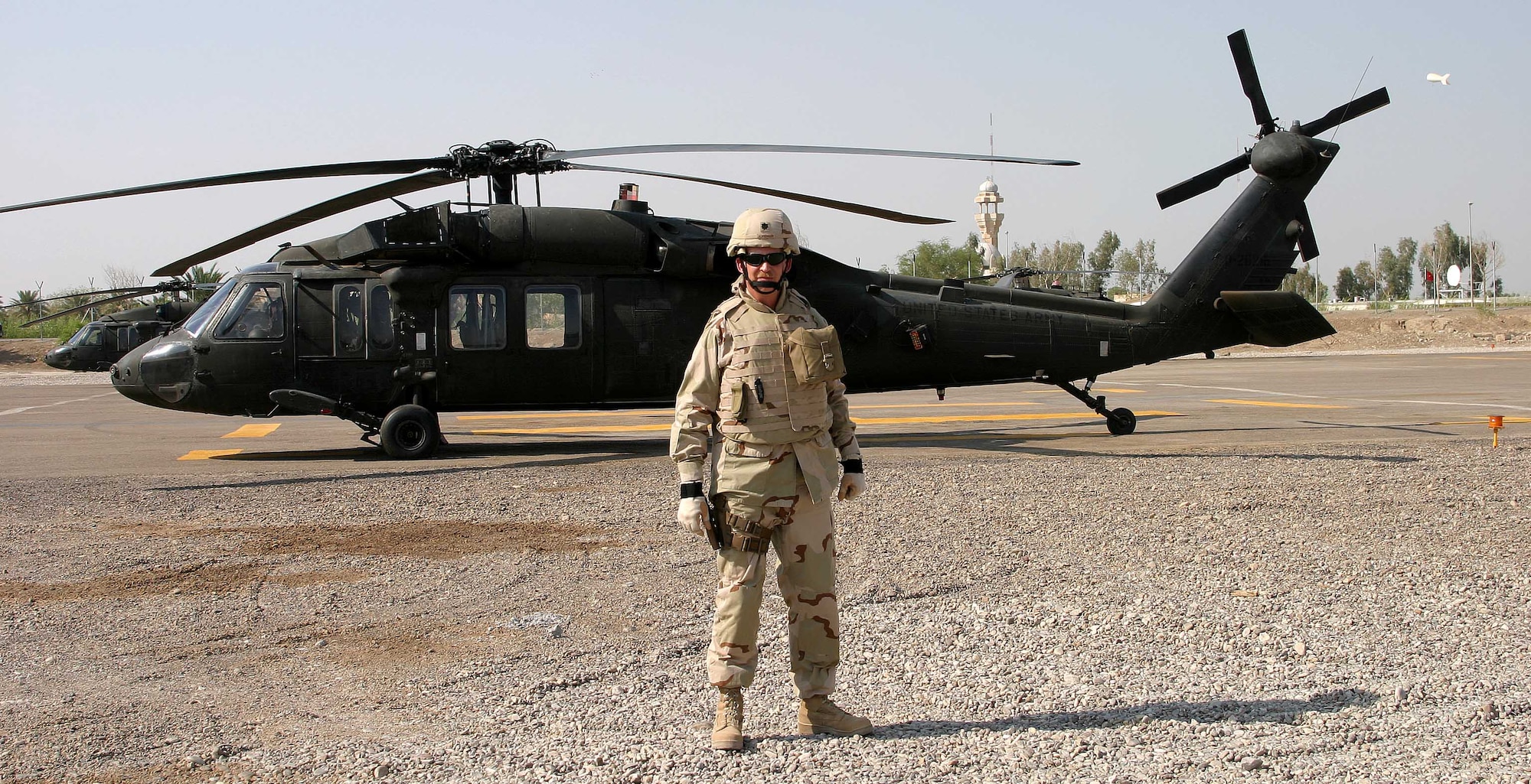 Former Deputy Director of the 704th Communications Squadron Lt. Col. Jay Sorensen is suited up for war at the Blackhawk Landing Zone next to his office on Camp Victory.