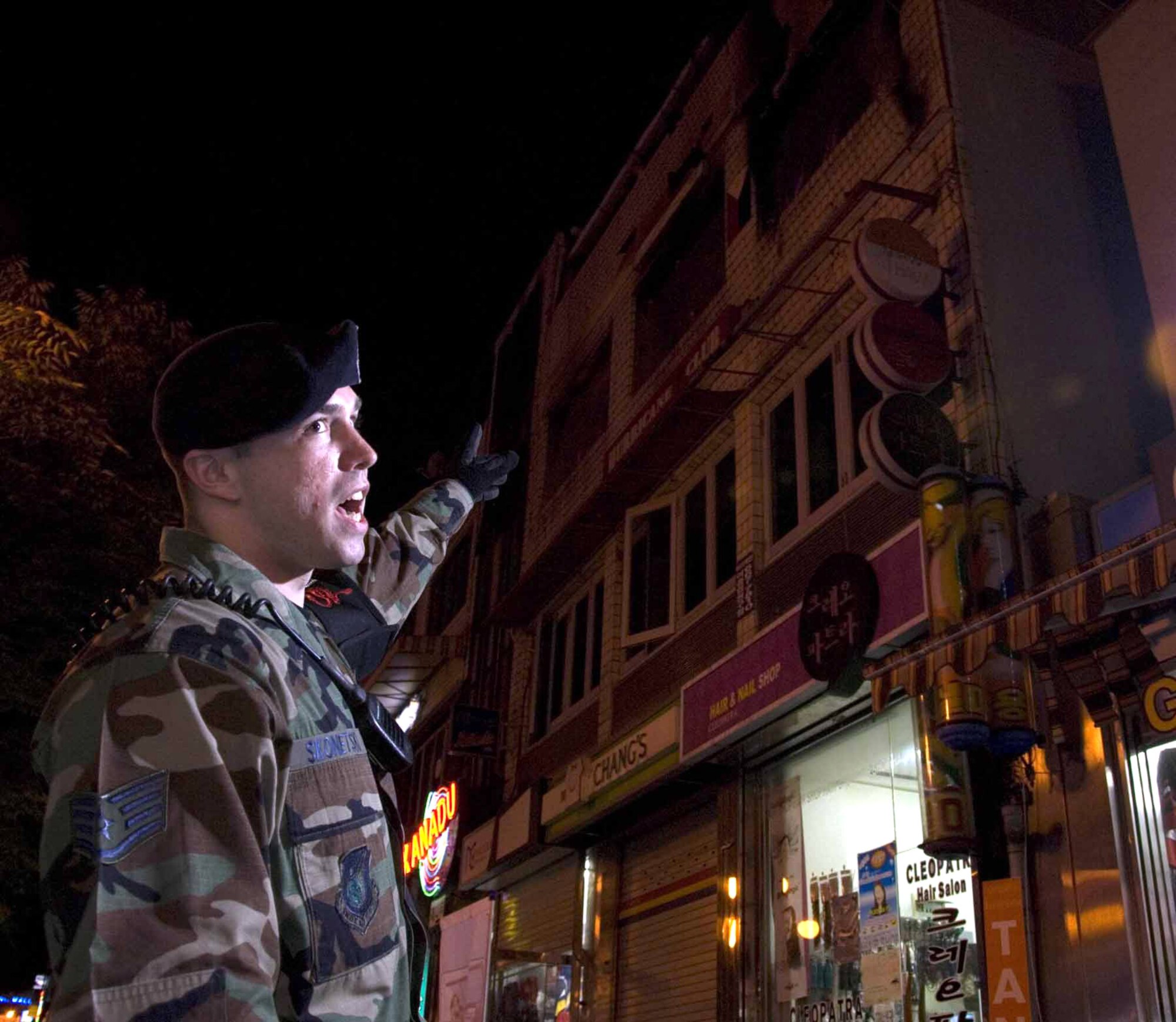 Staff Sgt. Michael Skonetski describes the building fire and how he and three other town patrol members helped evacuate patrons outside of Osan Air Base, South Korea. Sergeant Skonetski is a 51st Security Forces Squadron town patrol member. (U.S. Air Force photo/Master Sgt. Marlin Zimmerman) 
