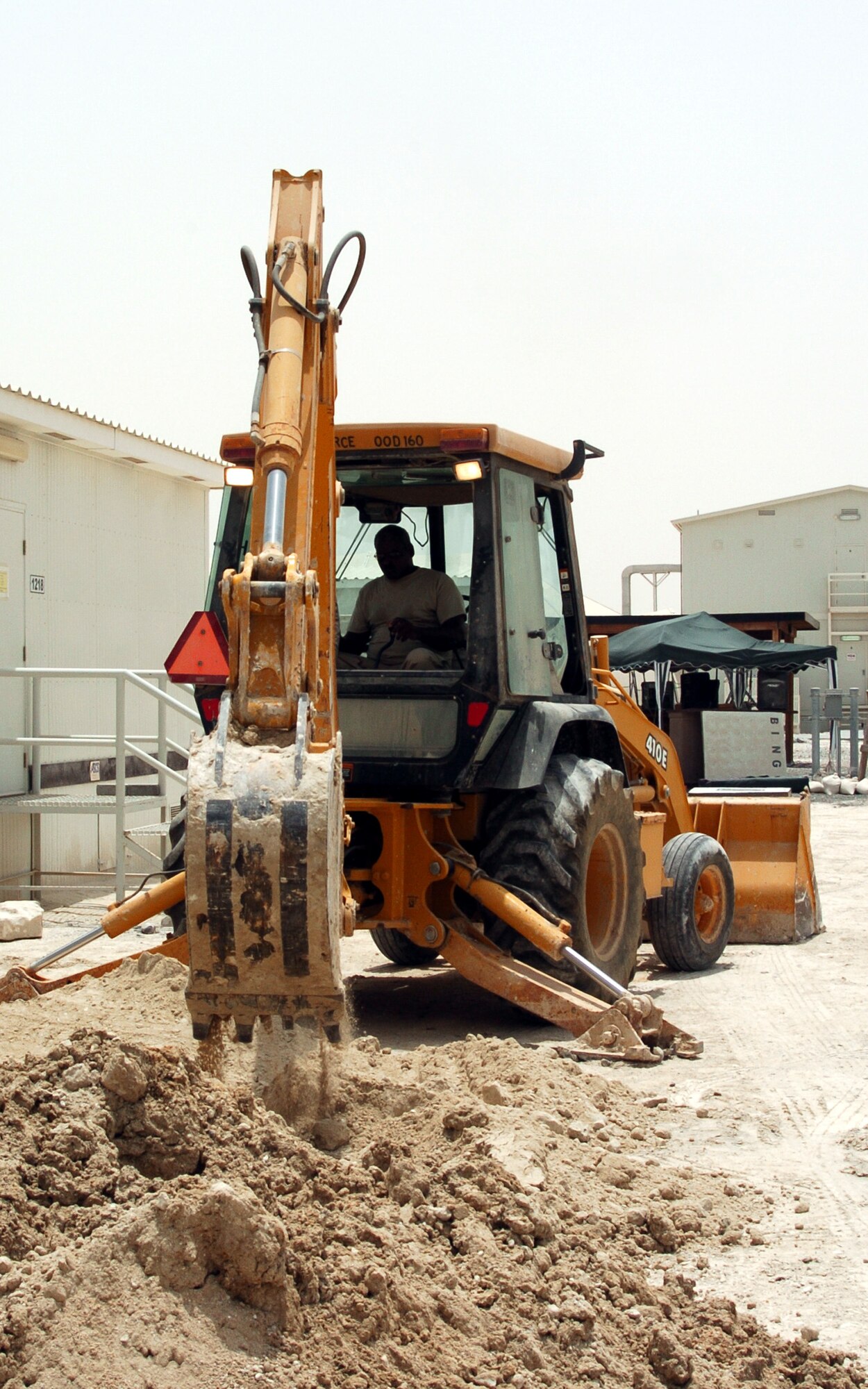 A reservist assigned to the 315th Airlift Wing, Charleston AFB, S.C., operates heavy machinery while deployed.  (courtesy photo)