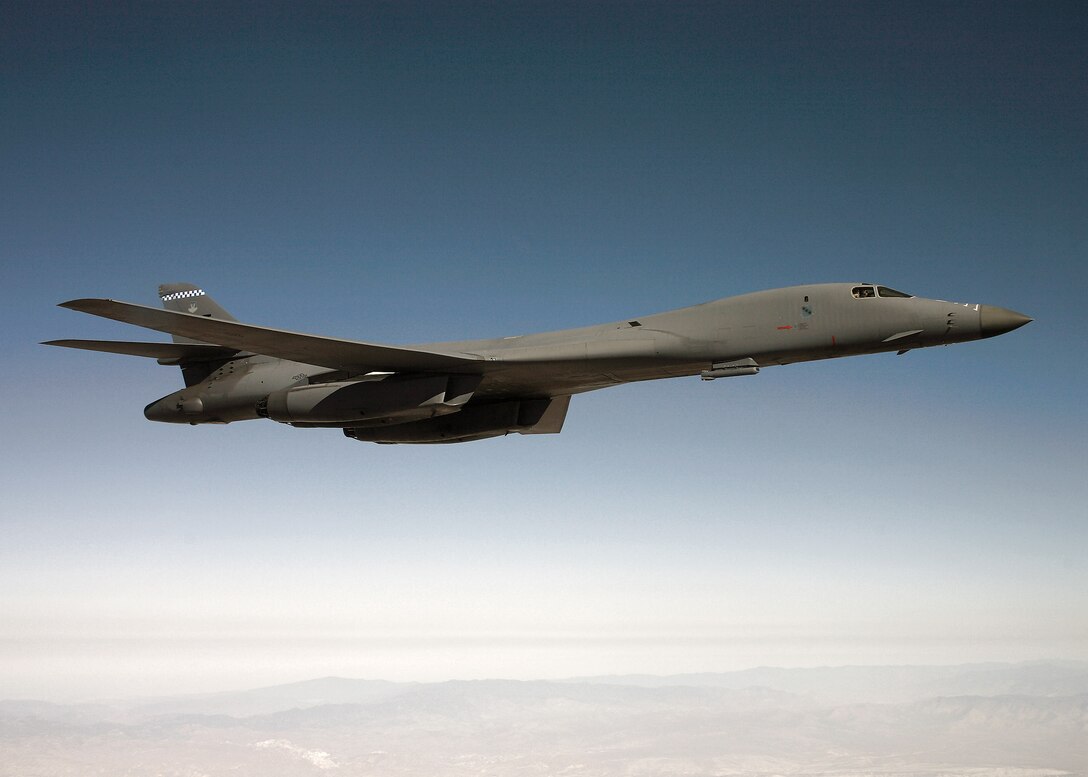 A B-1B Lancer flies on a testing mission carrying a sniper pod May 16 over Edwards Air Force Base, Calif. The sniper pod is scheduled to be fully operational by summer. (U.S. Air Force photo/Jet Fabara) 
