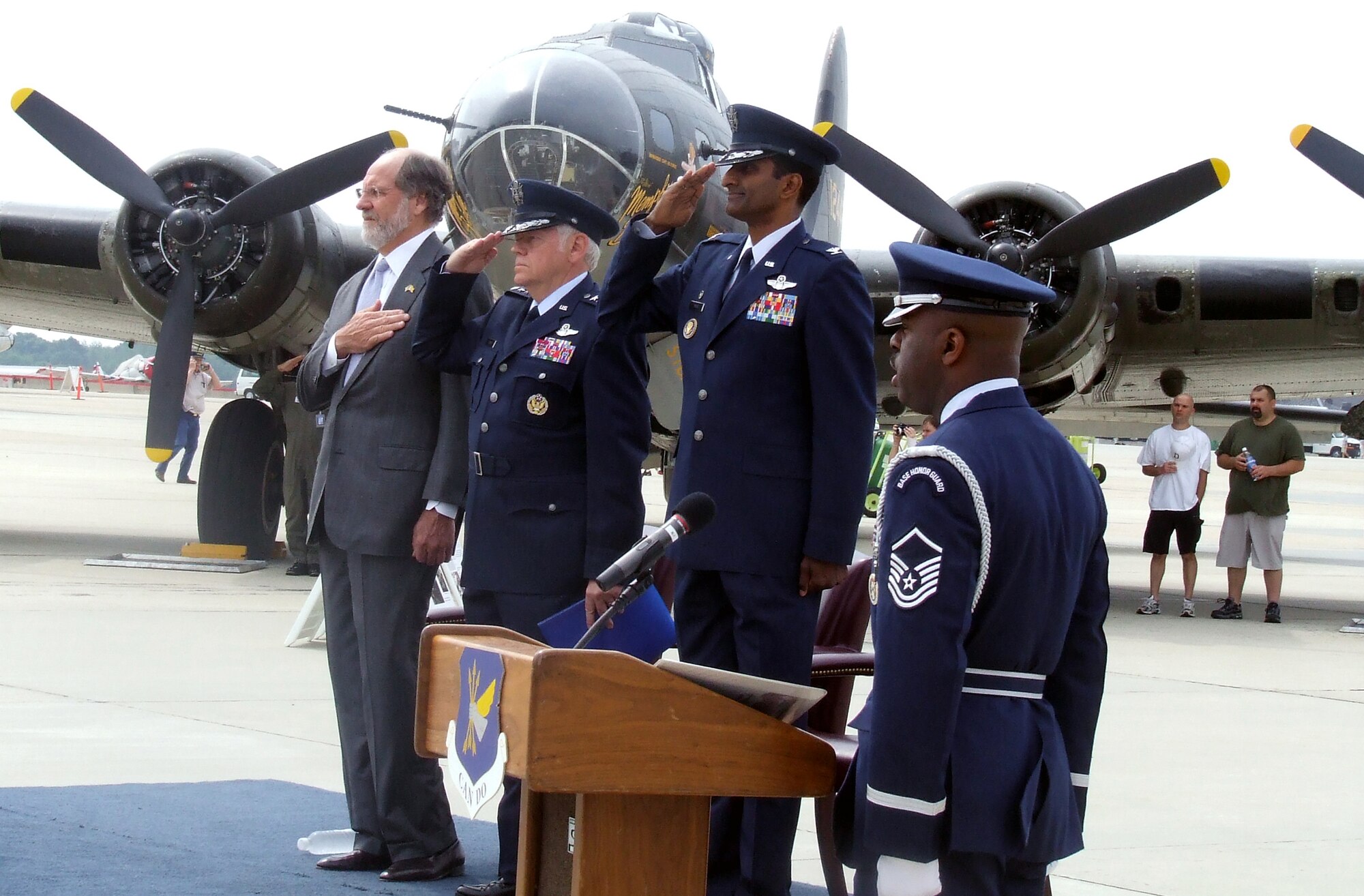 New Jersey Governor Jon Corzine, Air Mobility Command Commander Gen. Arthur Lichte, and 305th Air Mobility Wing Commander Col. Balan Ayyar, are on stage while the national anthem is sung by a member of the McGuire Air Force Base, N.J., Honor Guard during a wreath-laying ceremony for the McGuire Air Expo 2008 May 31.  The ceremony and Air Expo 2008 were culminating events for Air Force Week in Philadelphia.  More than 170,000 people attended the Air Expo.  (U.S. Air Force Photo/Tech. Sgt. Scott T. Sturkol)
