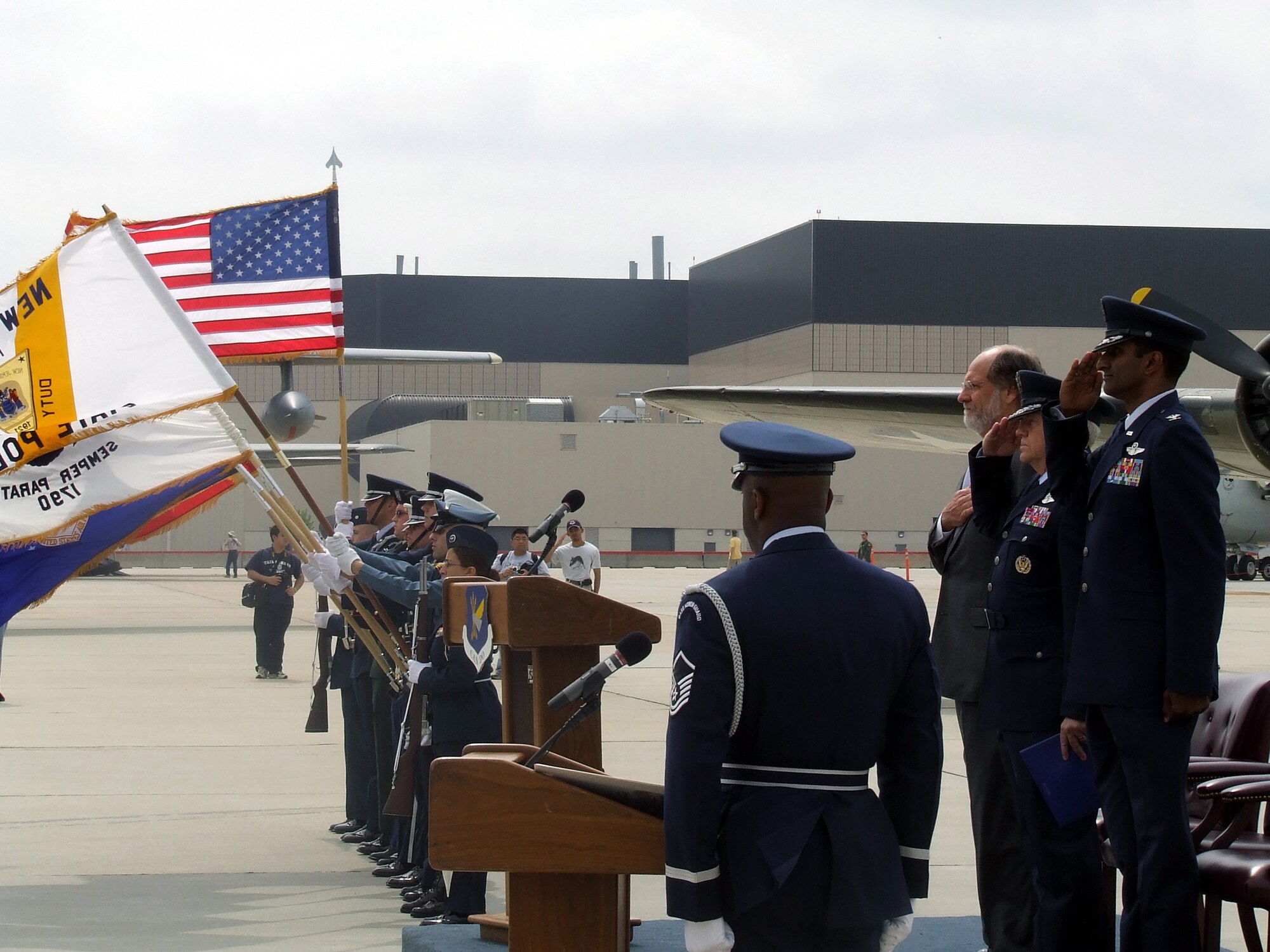 New Jersey Governor Jon Corzine, Air Mobility Command Commander Gen. Arthur Lichte, and 305th Air Mobility Wing Commander Col. Balan Ayyar, are on stage while the national anthem is sung by a member of the McGuire Air Force Base, N.J., Honor Guard during a wreath-laying ceremony for the McGuire Air Expo 2008 May 31.  The ceremony and Air Expo 2008 were culminating events for Air Force Week in Philadelphia.  More than 170,000 people attended the Air Expo.  (U.S. Air Force Photo/Tech. Sgt. Scott T. Sturkol)