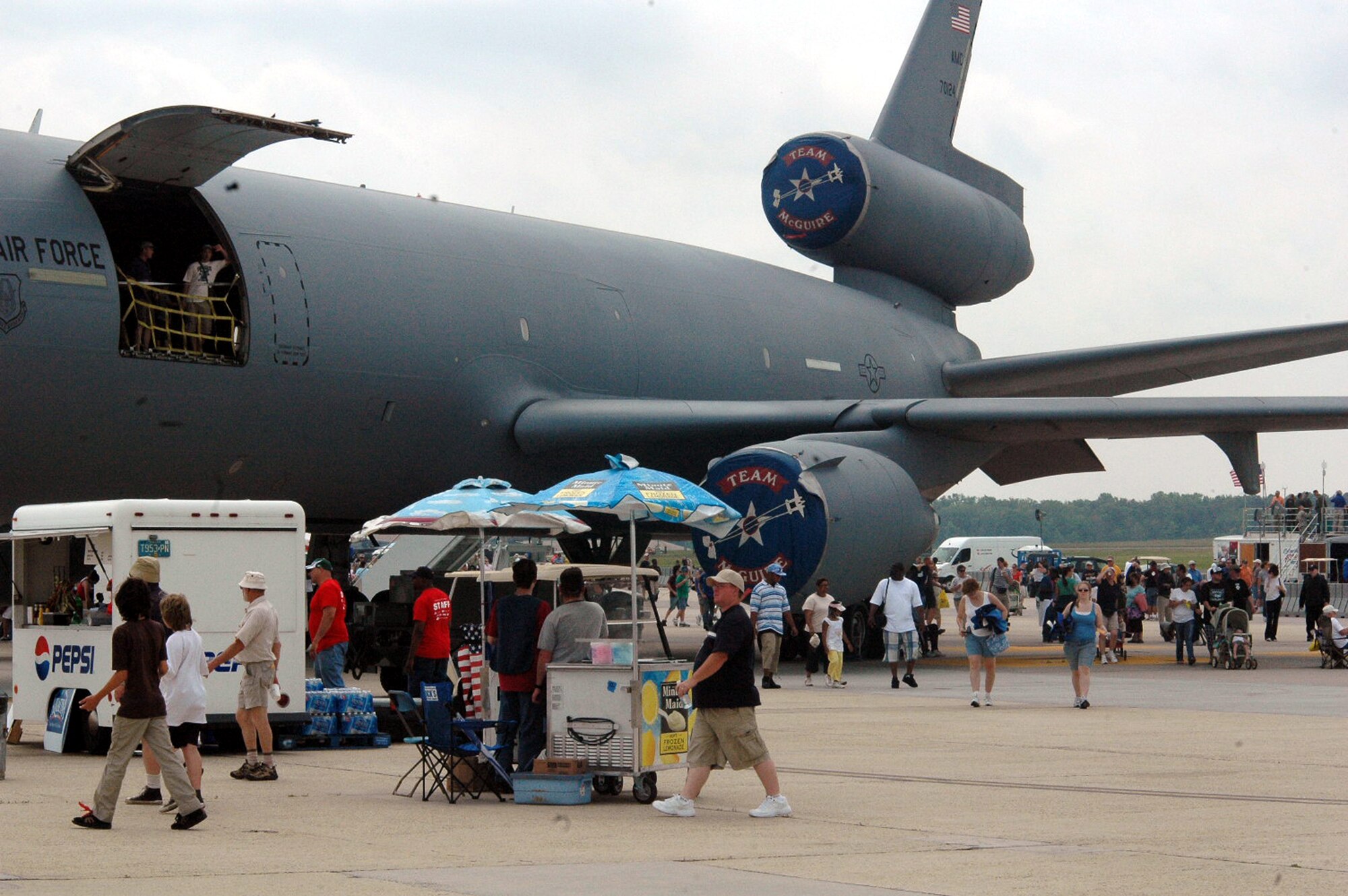 Visitors to the McGuire Air Force Base, N.J., Air Expo 2008 walk across the airfield May 31, 2008, on McGuire.  The expo was the culminating event for Air Force Week in Philadelphia.  Overall, through both days of the expo, more than 170,000 people visited.  (U.S. Air Force Photo/Tech. Sgt. Scott T. Sturkol)
