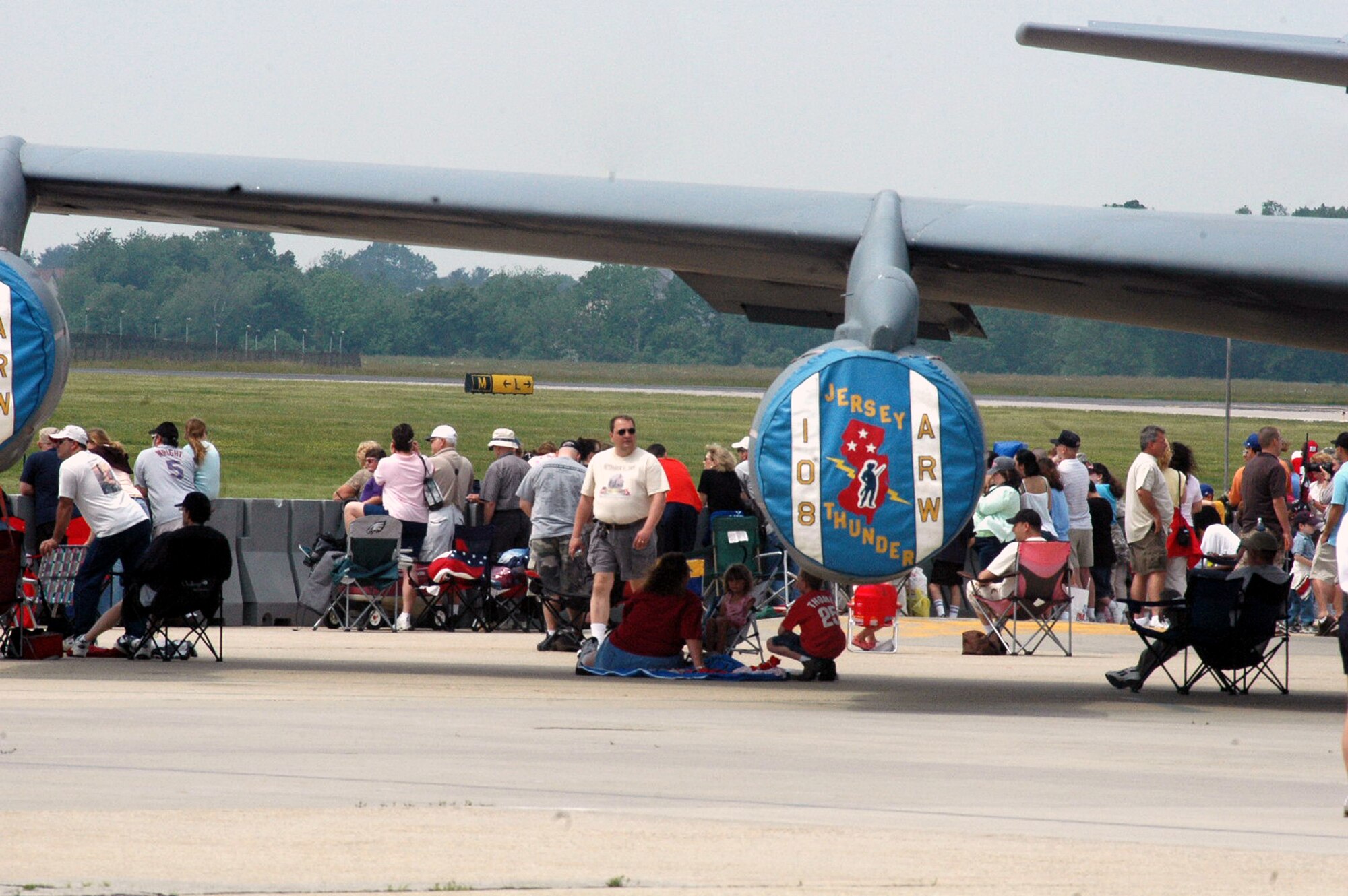 Visitors to the McGuire Air Force Base, N.J., Air Expo 2008 find their places for an aerial event May 31, 2008, on McGuire.  The expo was the culminating event for Air Force Week in Philadelphia.  Overall, through both days of the expo, more than 170,000 people visited.  (U.S. Air Force Photo/Tech. Sgt. Scott T. Sturkol)