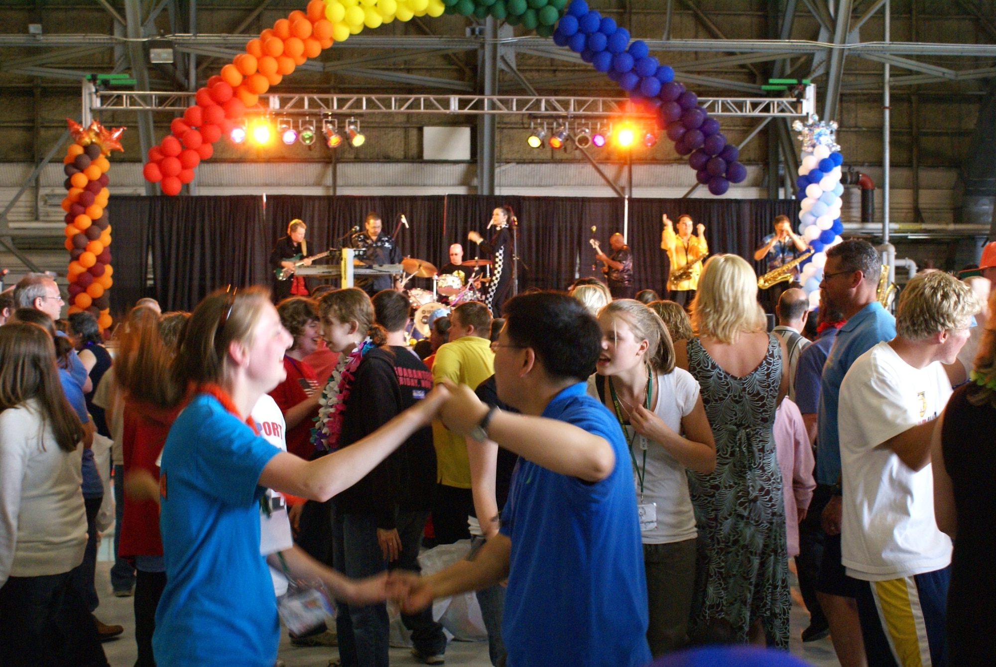 A large crowd celebrates during Saturday's victory dance in Hangar 1. (U.S. Air Force photo/Staff Sgt. Eric Burks)