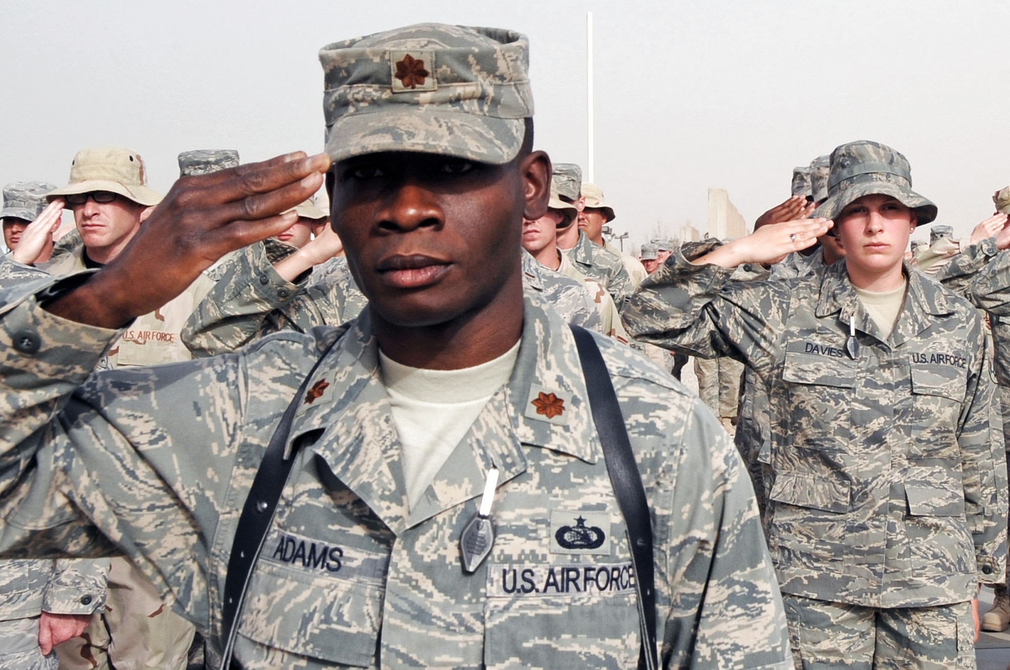 Maj. Terrence Adams salutes during a retreat ceremony May 15 at Ali Base, Iraq. Major Adams was born and raised in Tuskegee, Ala., and is now deployed to a unit in the 332nd Air Expeditionary Wing where the Tuskegee legend continues. Major Adams is the 407th Expeditionary Communications Squadron commander deployed from Tinker Air Force Base, Okla. (U.S. Air Force photo/Tech. Sgt. Sabrina Johnson) 
