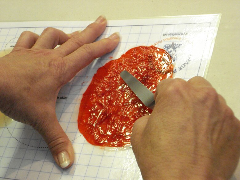 A student in the Moulage 101 class prepares a "wound." (U.S. Air Force courtesy photo)                                     