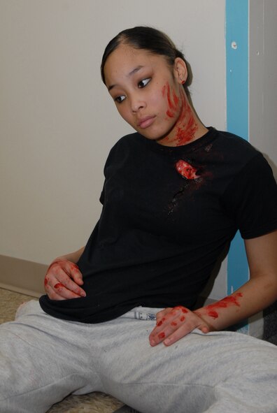 A moulaged gunshot victim appears lifeless from her injuries during a mass casualty exercise at the Malmstrom clinic in March. (U.S. Air Force photo/John Turner)