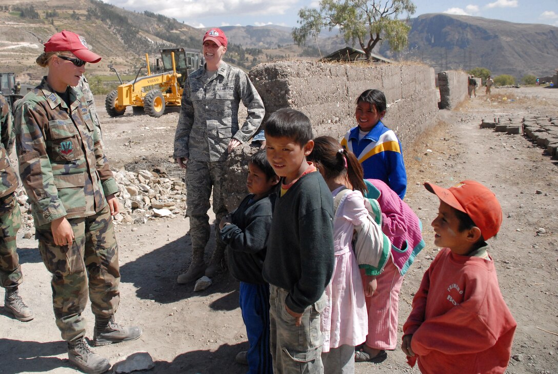 Captains Stacy Nimmo and Megan Leitch talk with the children of Yanama, Peru, during a visit to the construction site for a school being built in support of New Horizons Peru 2008, a humanitarian event that benefits thousands of Peruvians. Nearly 300 members from the U.S. Air Force, Army, Marines, and Navy came together to provide Peruvians with new schools, clinics, and water wells. The captains are deployed from the 820th RED HORSE Squadron at Nellis Air Force Base, Nev. (U.S. Air Force photo/Airman 1st Class Tracie Forte) 