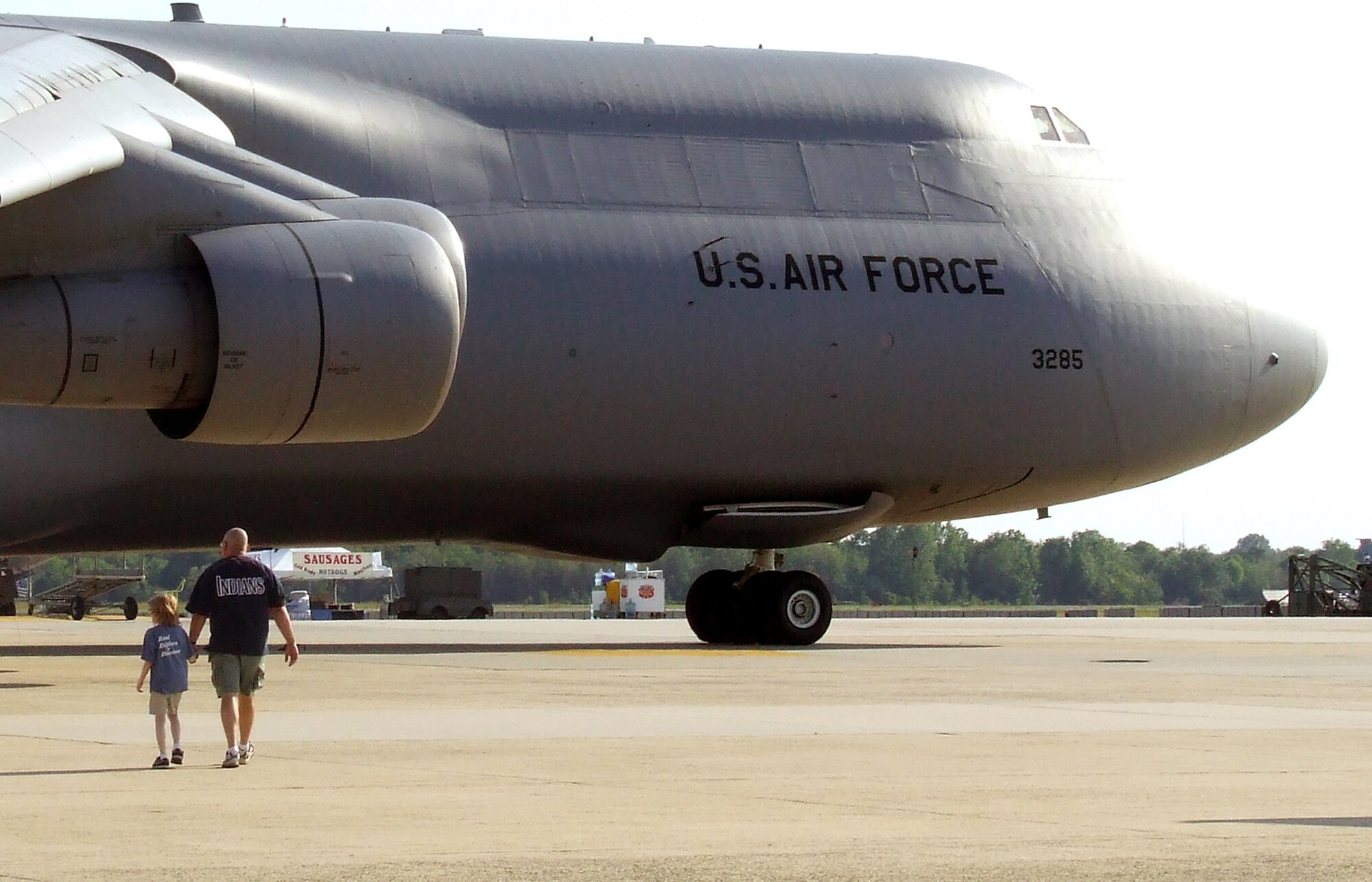 An Airman takes his daughter to look at a C-5 Galaxy up close May 30, 2008, during Military Family Night for the McGuire Air Force Base, N.J., Air Expo 2008.  Military families were able to see the static display aircraft a day before the expo was opened up to civilian visitors.  (U.S. Air Force Photo/Tech. Sgt. Scott T. Sturkol)