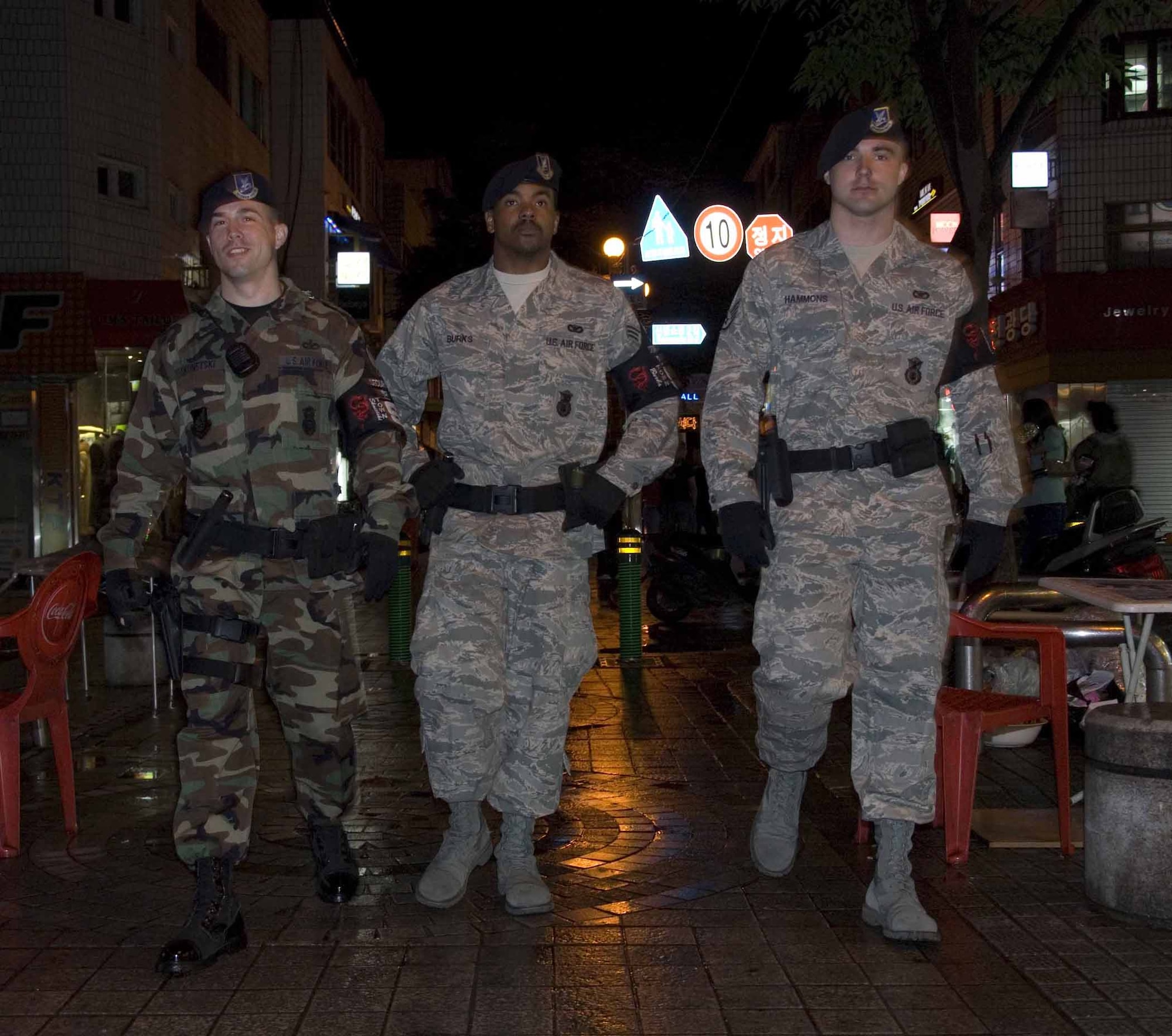 OSAN AIR BASE, Republic of Korea – (From left to right) Staff Sgt. Michael Skonetski, Senior Airman Michael Burks and Staff Sgt. Erick Hammons, 51st Security Forces Squadron’s Town Patrol members, patrol the downtown area June 4. The Airmen were among the first responders after a fire engulfed a local restaurant May 30. They helped evacuate patrons and provided crowd control until local authorities arrived. (U.S. Air Force photo/Master Sgt. Marlin Zimmerman)