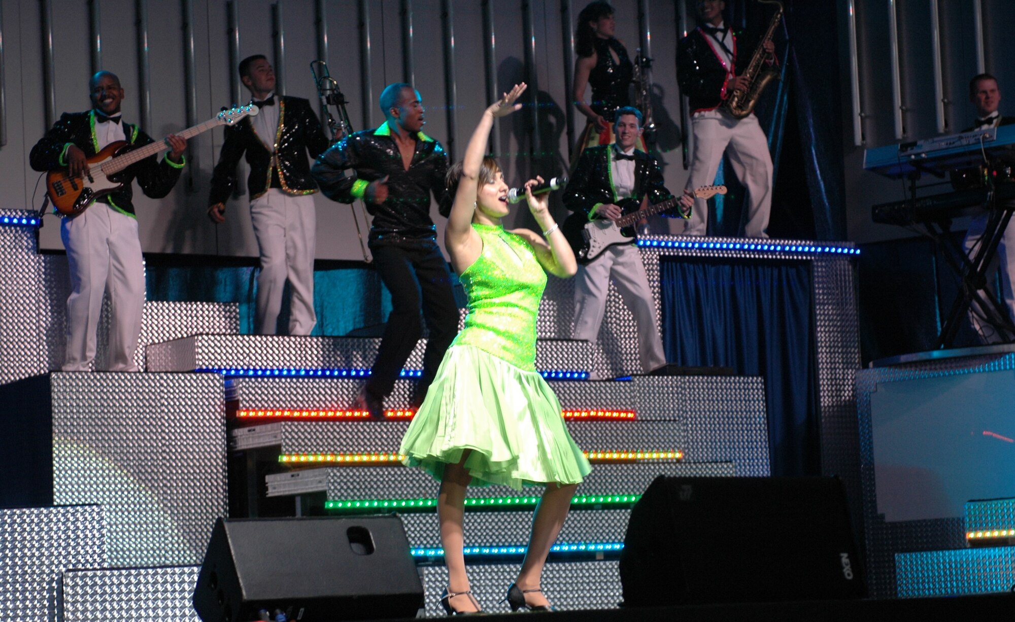 Tech. Sgt. Chandra Smith sings Gloria Estefan’s “Rhythm Is Gonna Get You” as a member of Tops in Blue, June 4. The performance team’s 2008 show in Tucson featured a member of the Arizona Air National Guard’s 162nd Fighter Wing. (Air National Guard Photo by Capt. Gabe Johnson)