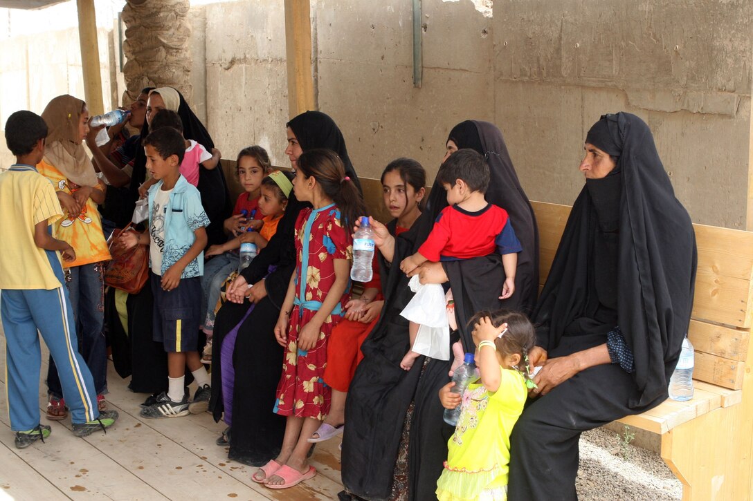 Iraqi women and children wait in line for free diapers, cereal and formula at the Radwaniyah Palace Complex Civil Military Operations Center, May 31, 2008. U.S. Army photo by Sgt. 1st Class Kerensa Hardy