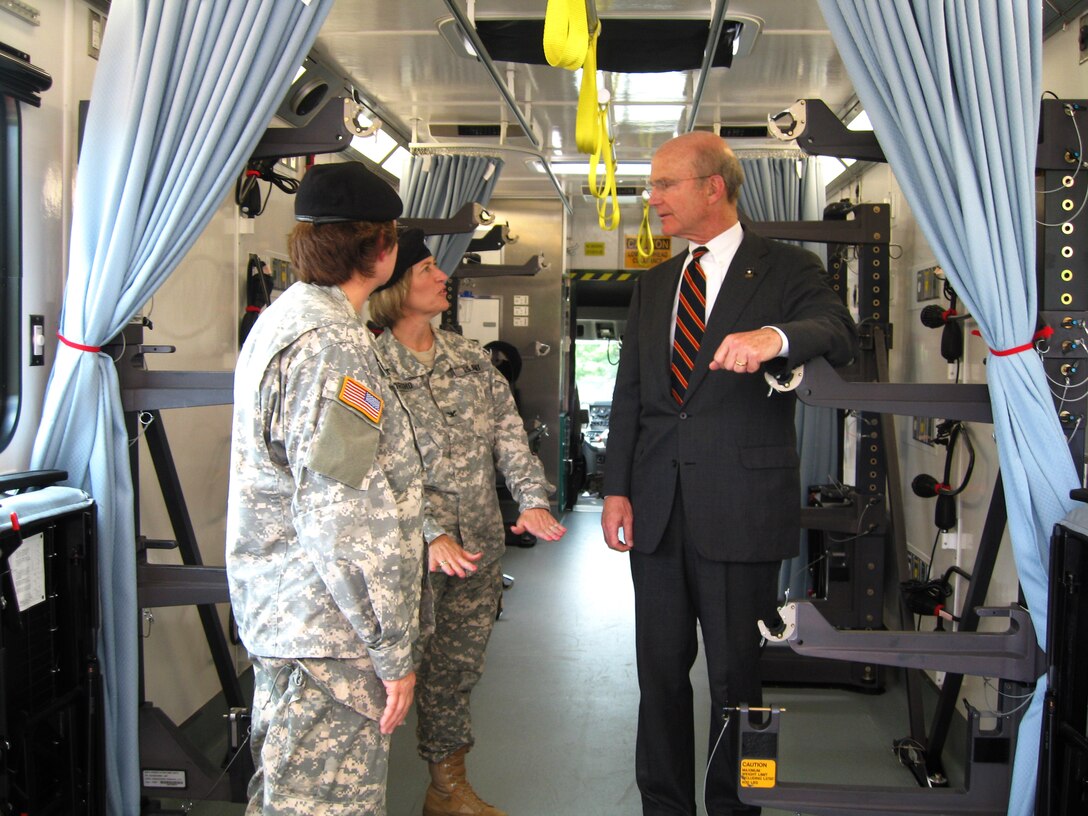Army Maj. Gen. Carla G. Hawley-Bowland, commander of North Atlantic Regional Medical Command and Walter Reed Army Medical Center, left, and Army Col. Patricia Horoho, commander of the Walter Reed Health Care System, center, give Army Secretary Pete Geren a tour of a Patient Evacuation Vehicle. Unveiled June 5, 2008, during a ceremony at Walter Reed Army Medical Center in Washington, D.C., the PEV is a semi-trailer-sized hospital on wheels that will make wounded soldiers'
ride to Walter Reed safer and smoother. Defense Dept. photo by John J. Kruzel

