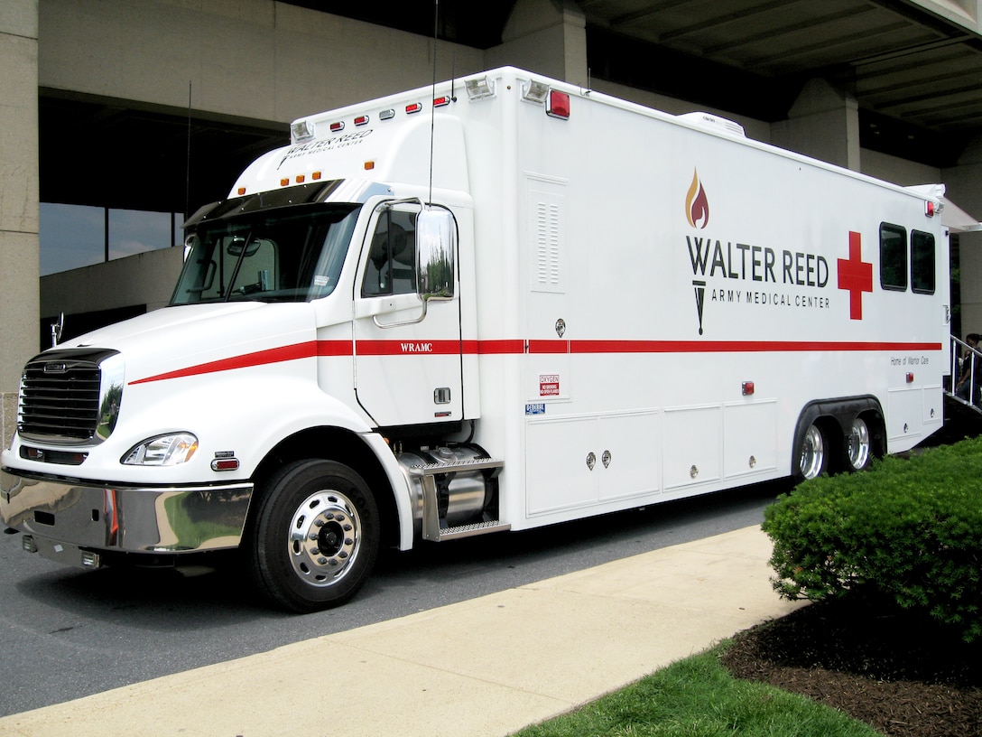 The newly unveiled Patient Evacuation Vehicle idles in front of Walter Reed Army Medical Center in Washington, D.C., June 5, 2008. One of an expected three-vehicle fleet, this PEV -- a semi-trailer-sized hospital on wheels -- will make wounded soldiers' ride to Walter Reed safer and smoother than the buses they slated are to replace. Defense Dept. photo by John J. Kruzel
