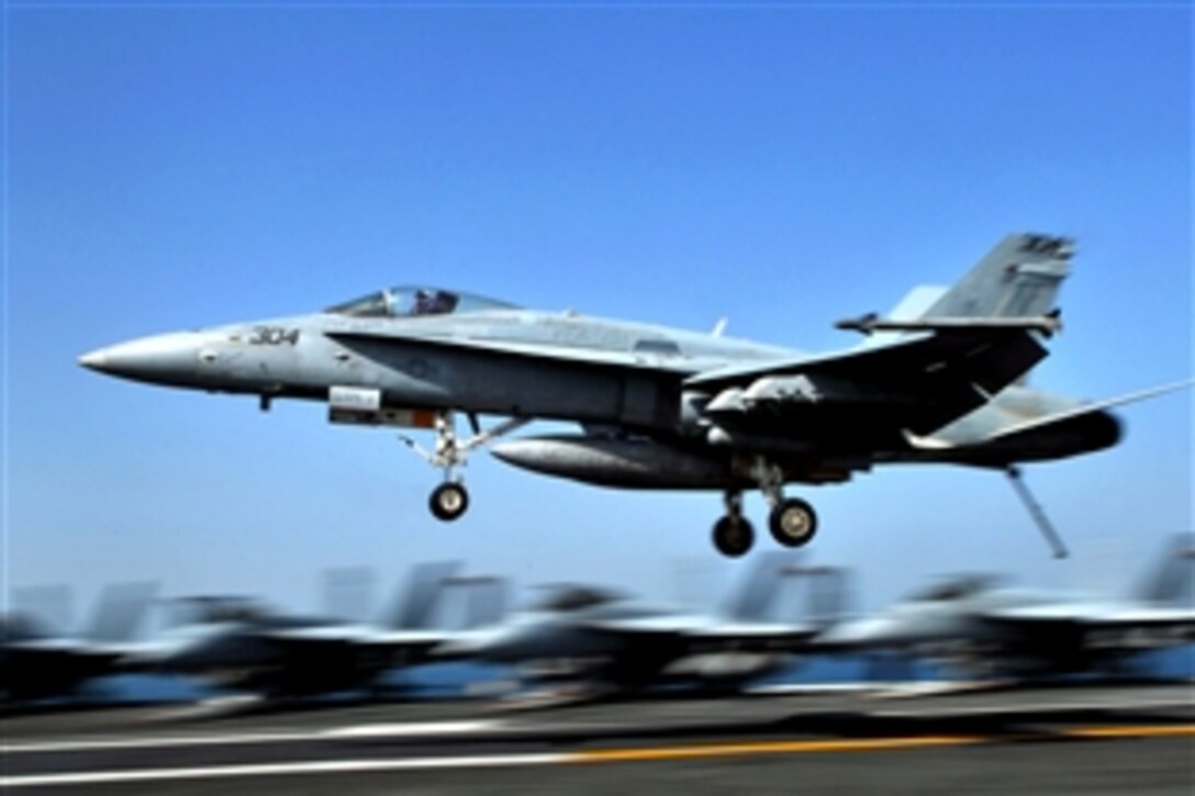 An F/A-18C Hornet assigned to the "Vigilantes" of Strike Fighter Squadron 151 lands aboard the aircraft carrier USS Abraham Lincoln in the Persian Gulf, June 4, 2008. Abraham Lincoln is deployed to the U.S. 5th Fleet area of responsibility supporting maritime security operations.