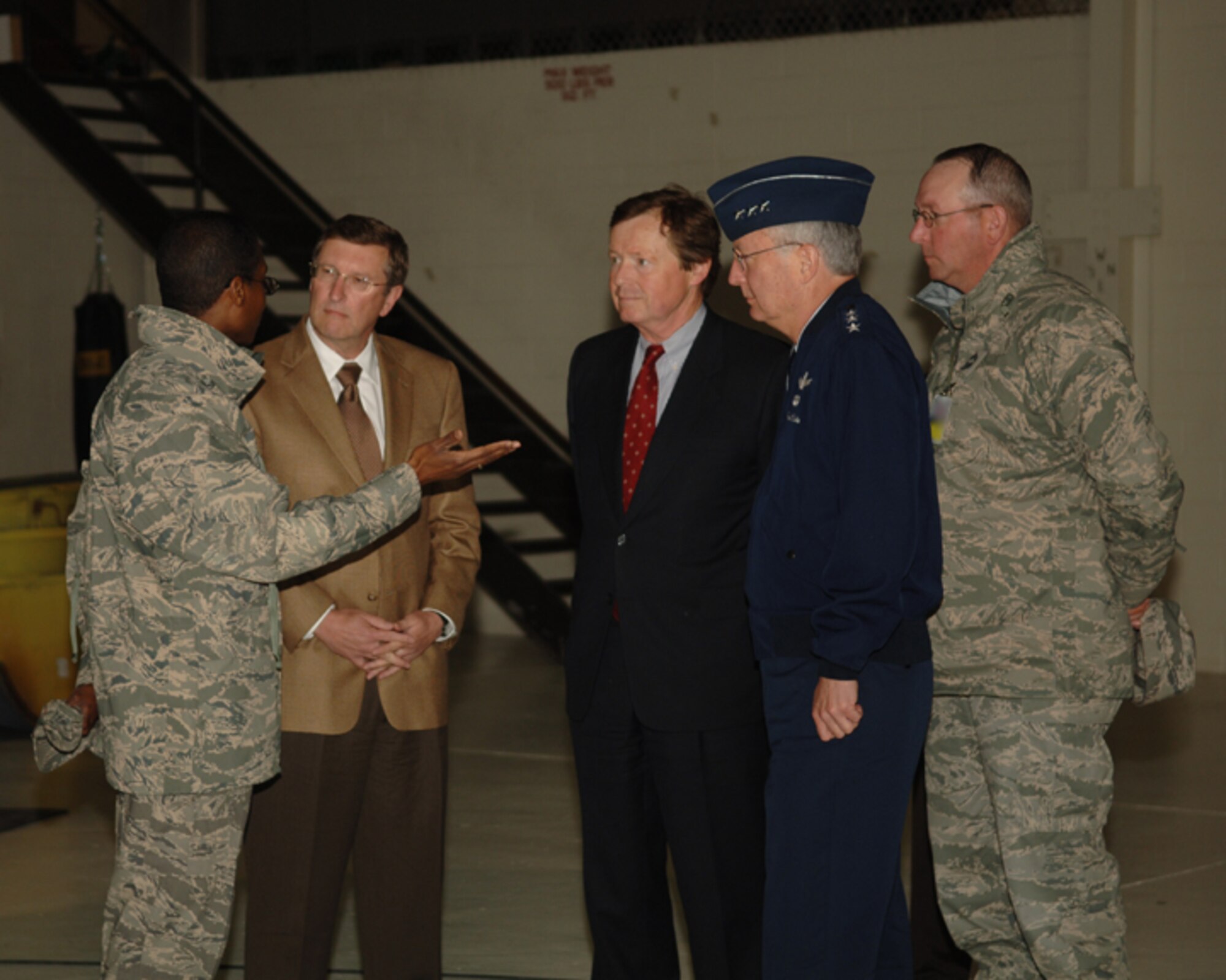 MINOT AIR FORCE BASE, N.D. -- Lt. Col. Jason Childs, 5th Maintenance Squadron commander, briefs N.D. Senator Kent Conrad, N.D. Rep. Earl Pomeroy and Lt. Gen. Frank Klotz, Air Force assistant vice chief of staff, during a B-52 tour here June 6. The tour was in preparation for a town meeting to discuss future plans for the B-52. (U.S. Air Force photo by Airman 1st Class Sharida Bishop)