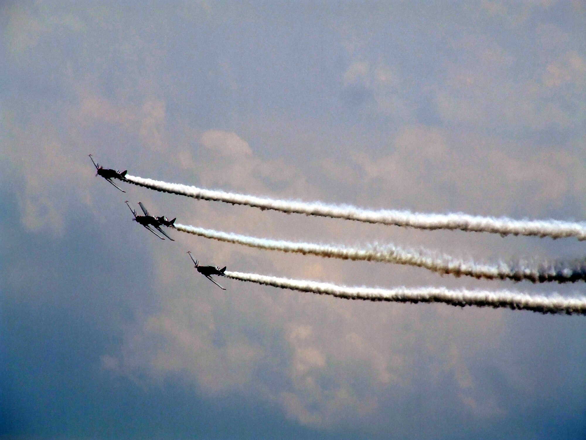 The Geico "Skywriters" fly World War II era aircraft in a formation during an aerial demonstration over McGuire Air Force Base, N.J., for the McGuire Air Expo June 1, 2008.  (U.S. Air Force Photo/Tech. Sgt. Scott T. Sturkol)