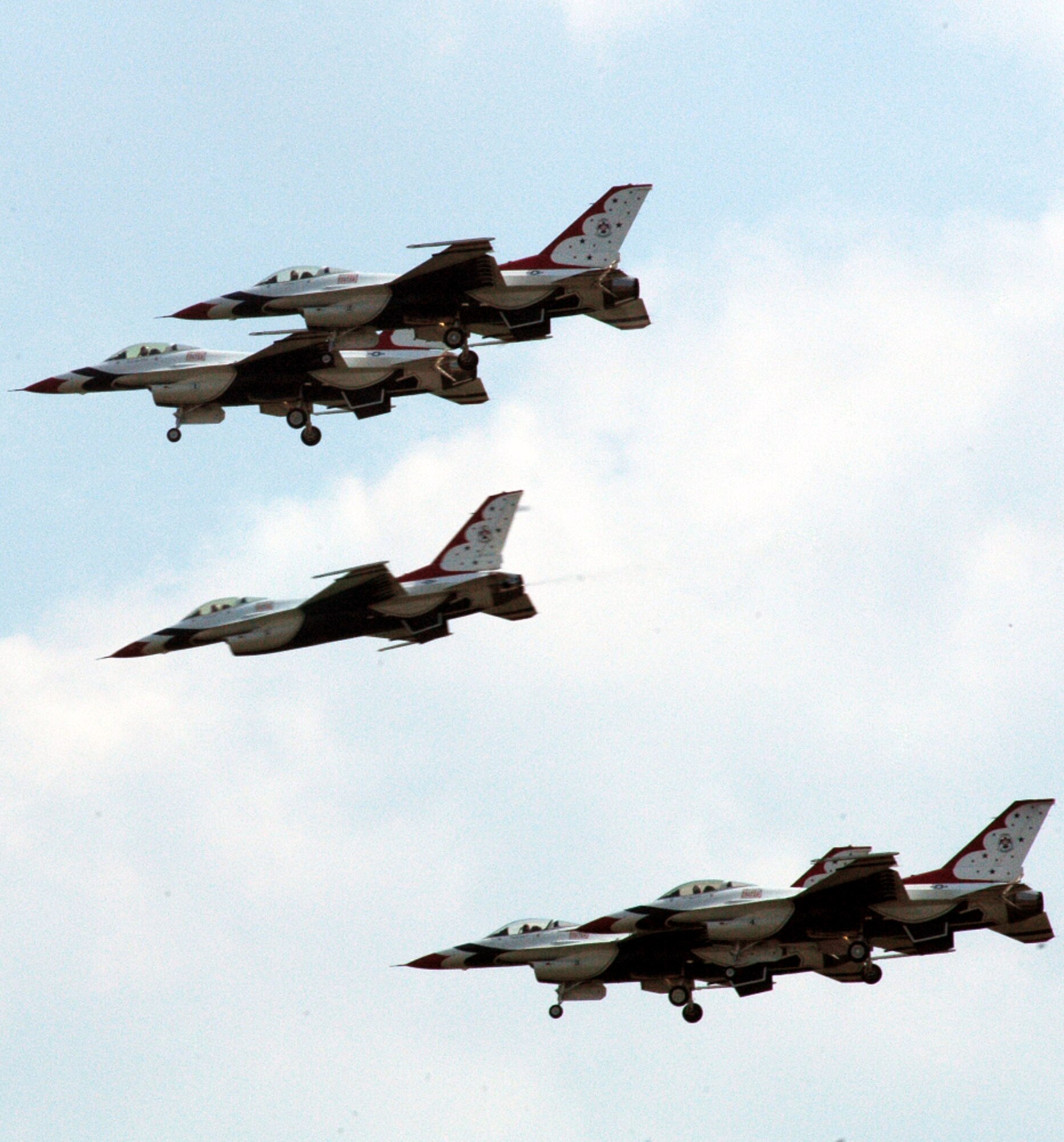 F-16 Fighting Falcons with the U.S. Air Force Thunderbirds aerial demonstration team, Nellis Air Force Base, Nev., fly during the McGuire Air Force Base, N.J., Air Expo June 1, 2008.  The Air Expo was the final event for Air Force Week in Philadelphia and more than 170,000 people attended.  (U.S. Air Force Photo/Tech. Sgt. Scott T. Sturkol)