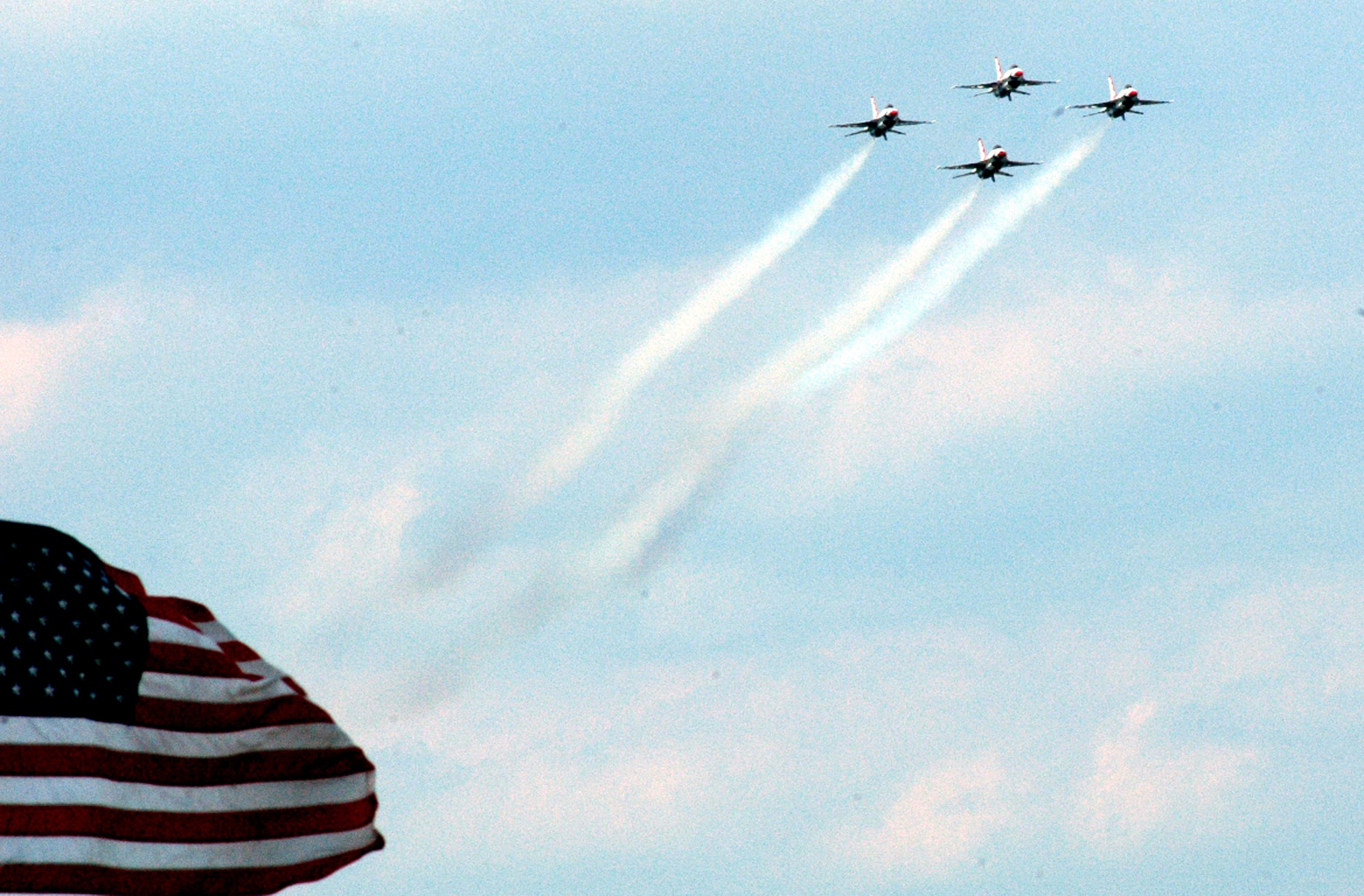 F-16 Fighting Falcons with the U.S. Air Force Thunderbirds aerial demonstration team, Nellis Air Force Base, Nev., fly in a tight-ship formation during the McGuire Air Force Base, N.J., Air Expo June 1, 2008.  The Air Expo was the final event for Air Force Week in Philadelphia and more than 170,000 people attended.  (U.S. Air Force Photo/Tech. Sgt. Scott T. Sturkol)