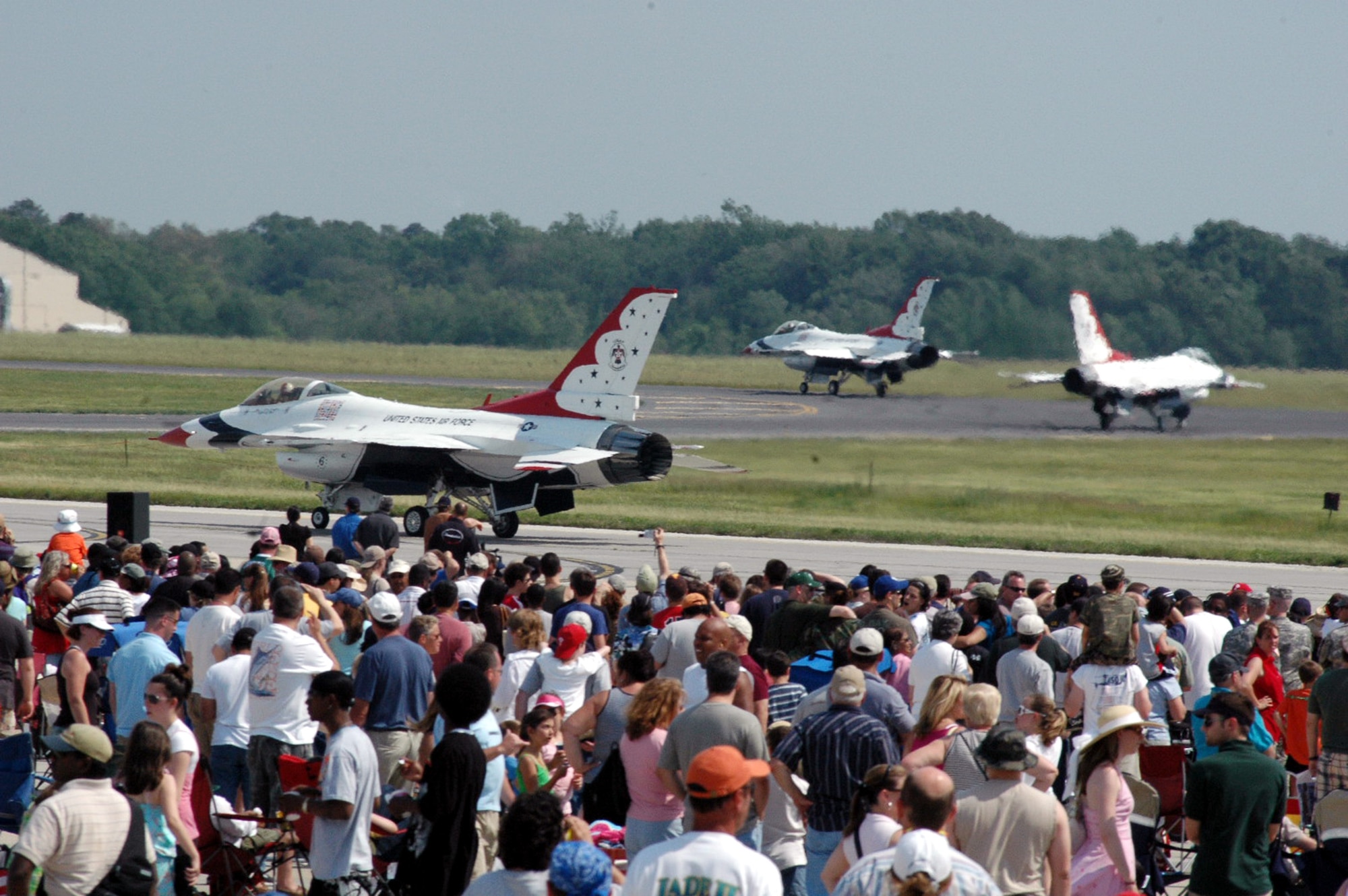 Visitors watch the U.S. Air Force Thunderbird F-16 Fighting Falcons roll out for their performance at McGuire Air Force Base, N.J., during the McGuire Air Expo 2008 June 1.  More than 170,000 people attended the Air Expo.  (U.S. Air Force Photo/Tech. Sgt. Scott T. Sturkol)