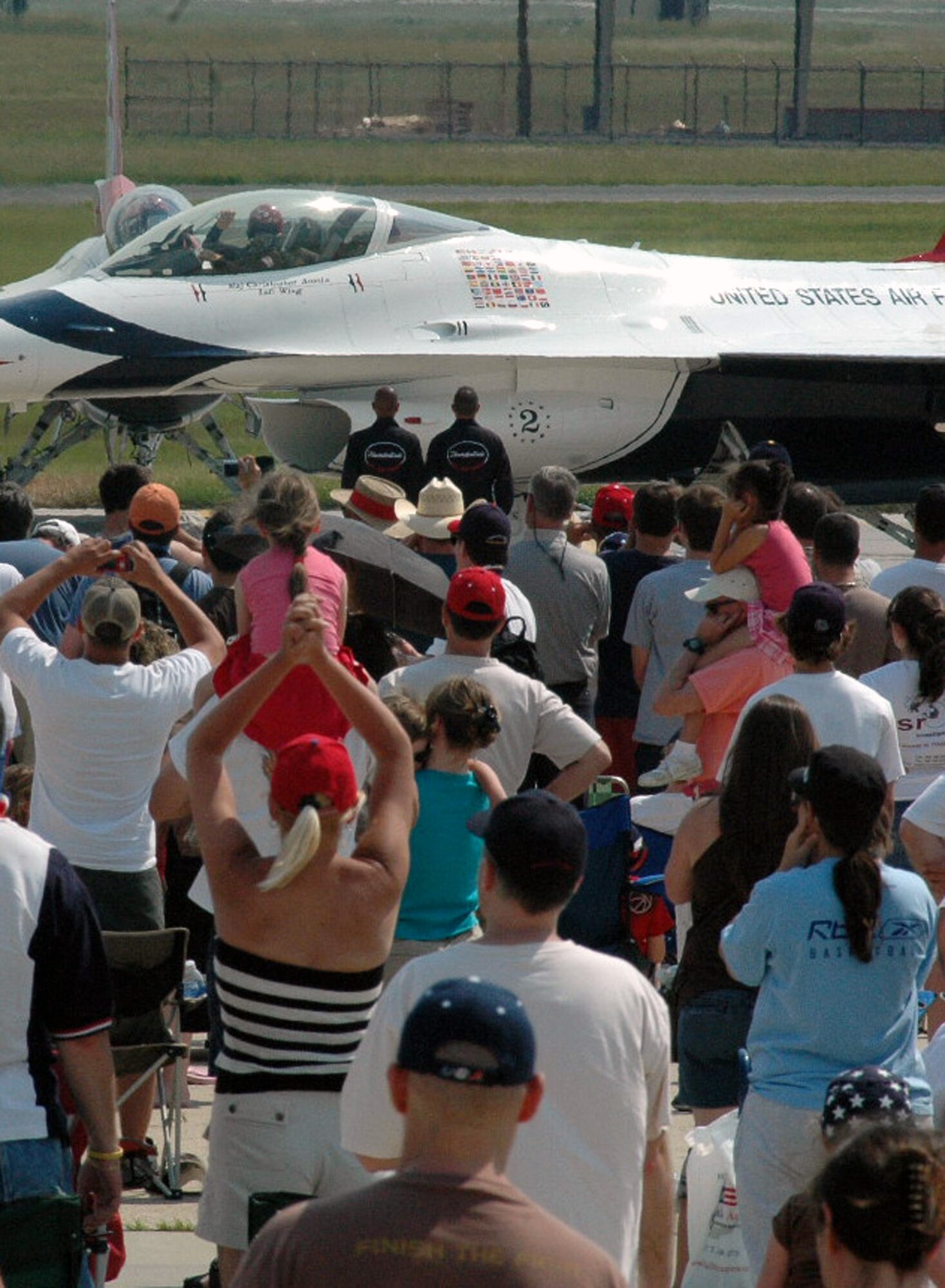 Visitors watch the U.S. Air Force Thunderbird F-16 Fighting Falcons roll out for their performance at McGuire Air Force Base, N.J., during the McGuire Air Expo 2008 June 1.  More than 170,000 people attended the Air Expo.  (U.S. Air Force Photo/Tech. Sgt. Scott T. Sturkol)