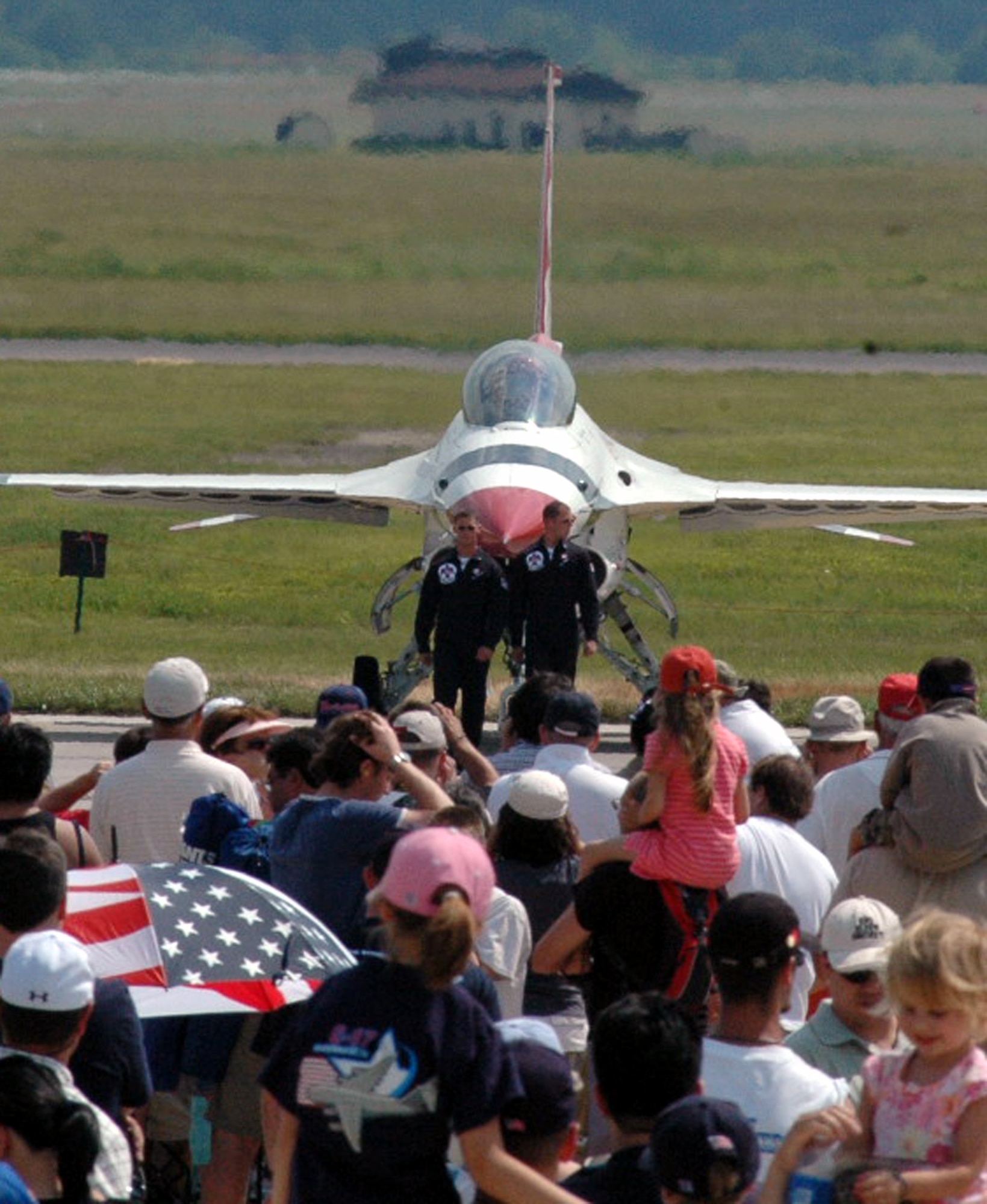 Visitors watch the U.S. Air Force Thunderbird perform their "ground show" at McGuire Air Force Base, N.J., during the McGuire Air Expo 2008 June 1.  More than 170,000 people attended the Air Expo.  (U.S. Air Force Photo/Tech. Sgt. Scott T. Sturkol)