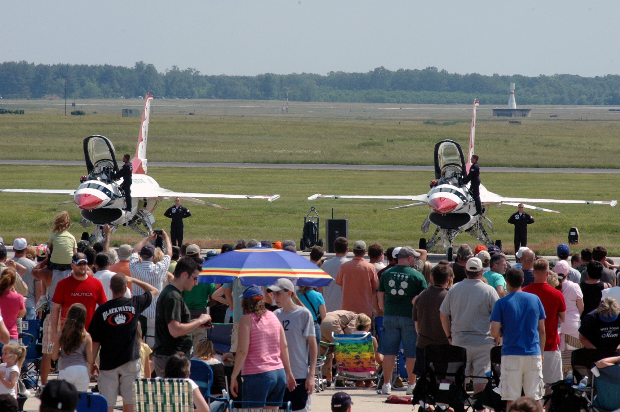 Visitors watch the U.S. Air Force Thunderbird perform their "ground show" at McGuire Air Force Base, N.J., during the McGuire Air Expo 2008 June 1.  More than 170,000 people attended the Air Expo.  (U.S. Air Force Photo/Tech. Sgt. Scott T. Sturkol)