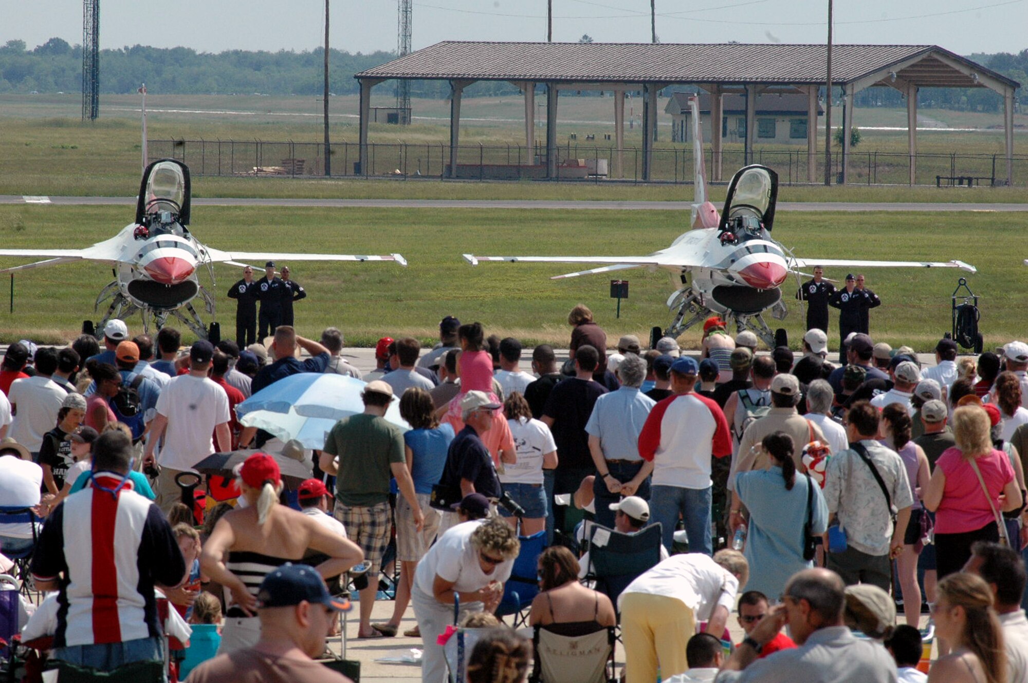 Visitors watch the U.S. Air Force Thunderbird perform their "ground show" at McGuire Air Force Base, N.J., during the McGuire Air Expo 2008 June 1.  More than 170,000 people attended the Air Expo.  (U.S. Air Force Photo/Tech. Sgt. Scott T. Sturkol)