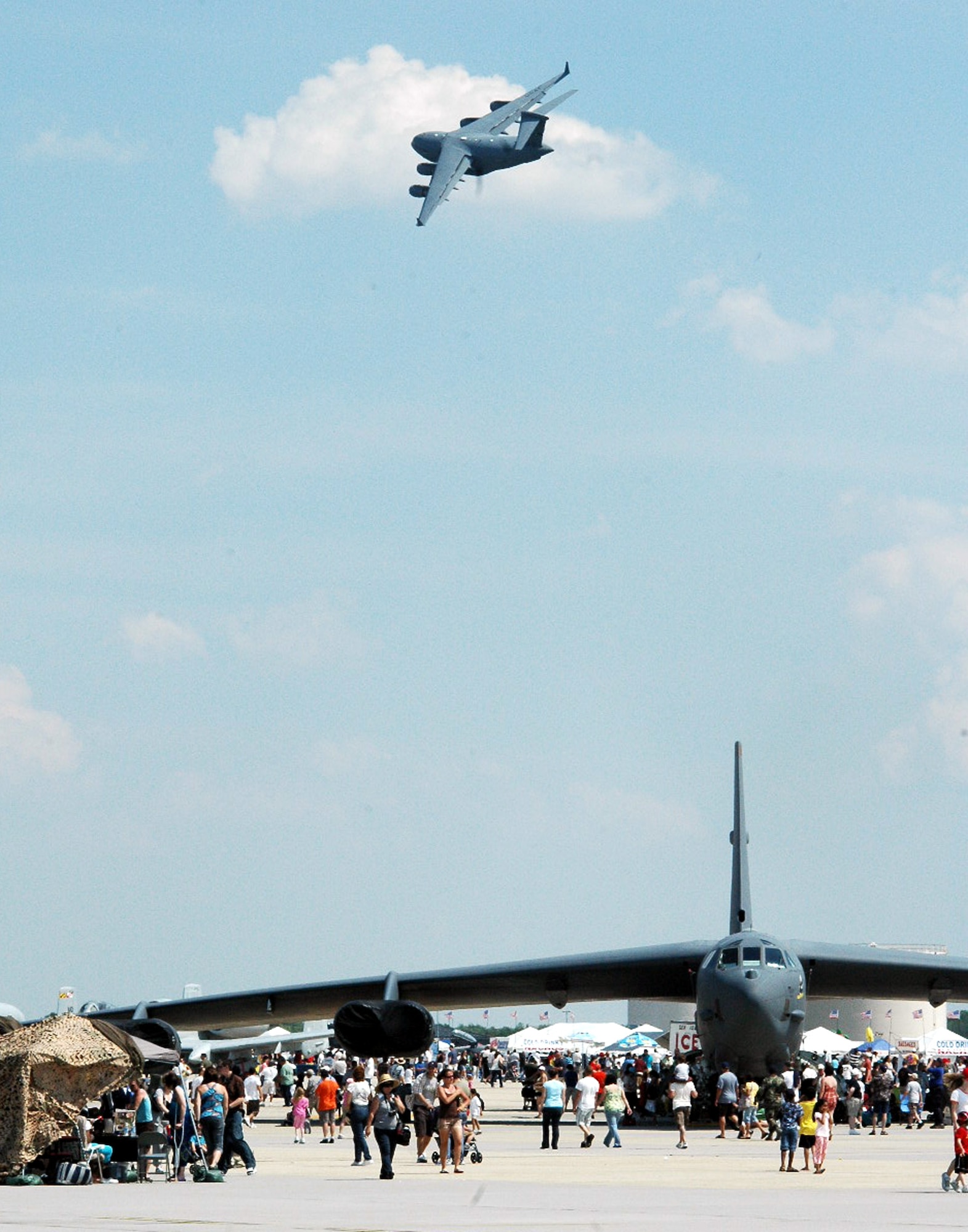 A C-17 Globemaster III flies over the airfield at McGuire Air Force Base, N.J., during the McGuire Air Expo 2008 June 1.  More than 170,000 people attended the Air Expo.  (U.S. Air Force Photo/Tech. Sgt. Scott T. Sturkol)