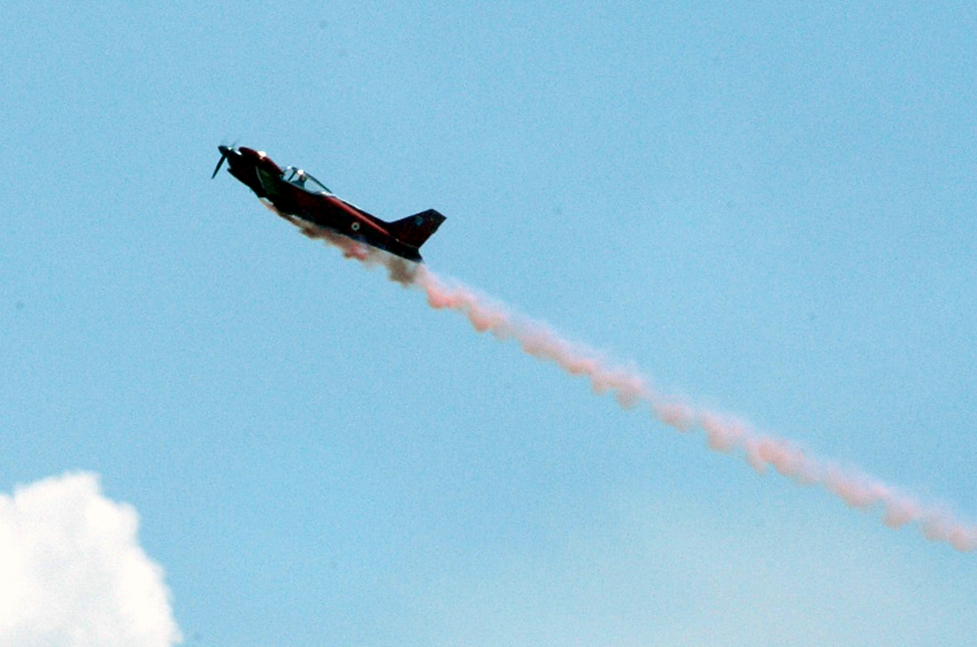 A prop-driven aircraft rises up from the airfield at McGuire Air Force Base, N.J., at the start of an aerial demonstration for McGuire Air Expo 2008 June 1.  More than 170,000 people attended the Air Expo.  (U.S. Air Force Photo/Tech. Sgt. Scott T. Sturkol)