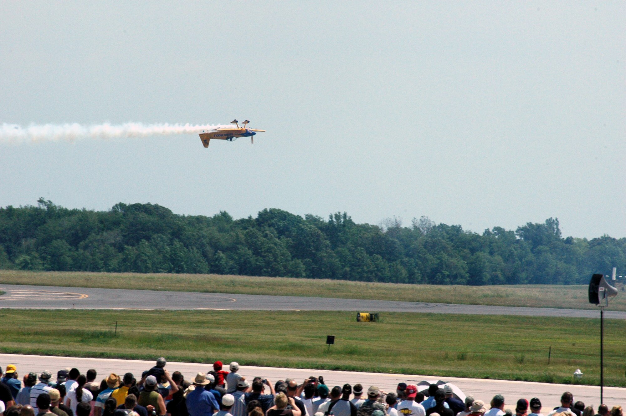 A prop-driven plane flown by the flying team for Embry-Riddle Aeronautical University flies upside-down over the airfield at McGuire Air Force Base, N.J., during the McGuire Air Expo 2008 June 1.  More than 170,000 people attended the Air Expo.  (U.S. Air Force Photo/Tech. Sgt. Scott T. Sturkol)
