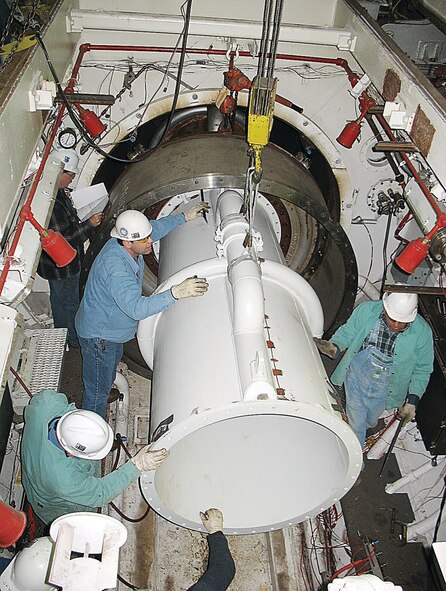 From left (foreground) Aerospace Testing Alliance (ATA) boilermakers Allen Gardner, Allen Gardner, Rusty Hargis and Don Metcalf install the diffuser insert in the T-3 exhaust duct. (Photo by Ray Joellenbeck) 
